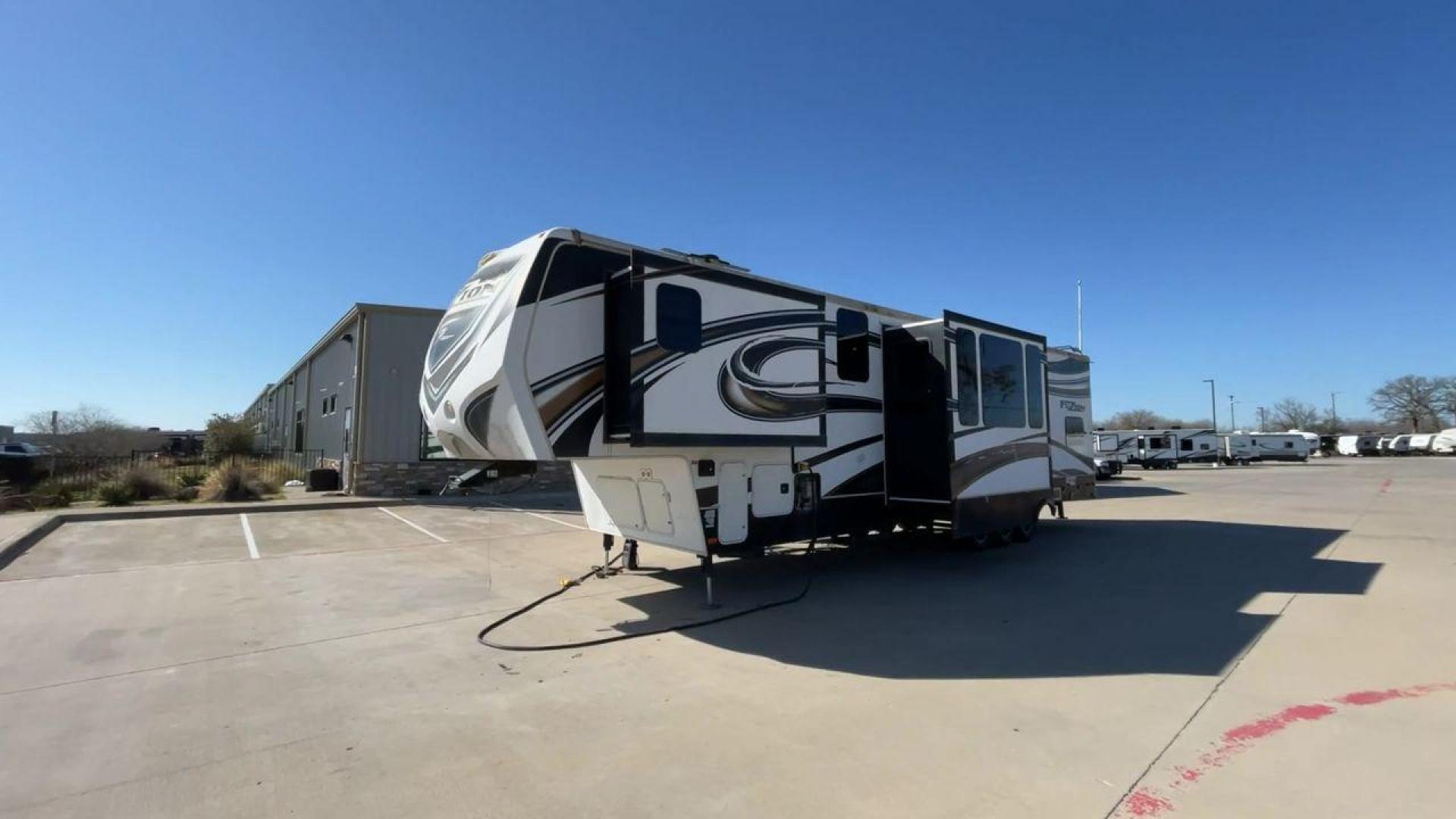 2013 WHITE KEYSTONE FUZION FZ399 - (4YDF39923DF) , Length: 41 ft. | Dry Weight: 13,880 lbs. | Gross Weight: 18,000 lbs. | Slides: 3 transmission, located at 4319 N Main Street, Cleburne, TX, 76033, (817) 221-0660, 32.435829, -97.384178 - The 2013 Keystone Fuzion FZ399 toy hauler measures 41 ft in length, 8.5 ft in width, and 13.25 ft in height. It has a dry weight of 13,880 lbs with a payload capacity of 4,120 lbs. The GVWR is 18,000 lbs and has a hitch weight of 3,560 lbs. This has a triple axle and triple slide with one 20 ft powe - Photo#5