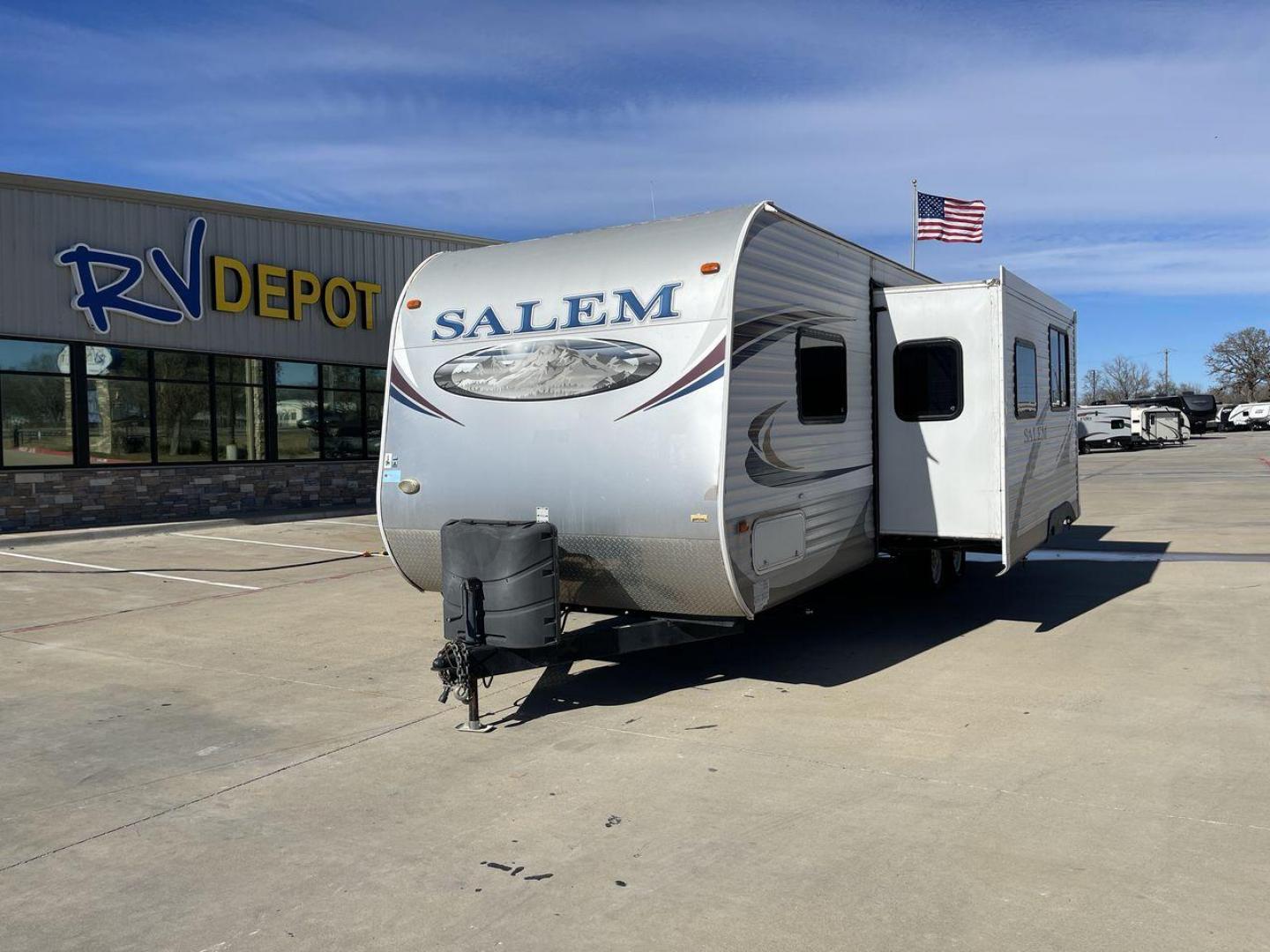 2013 GRAY SALEM 27DBUD - (4X4TSMC22DA) , Length: 29.5 ft. | Dry Weight: 6,164 lbs. | Slides: 1 transmission, located at 4319 N Main Street, Cleburne, TX, 76033, (817) 221-0660, 32.435829, -97.384178 - This 2013 Salem 27DBUD travel trailer is slightly about 30' long. It is a two-axle configuration. This camper has one slide and is quite comfy! The Salem's exterior is built of metal and painted white with gray markings. The kitchen is L-shaped. There is a matching refrigerator, oven/stove, and micr - Photo#0