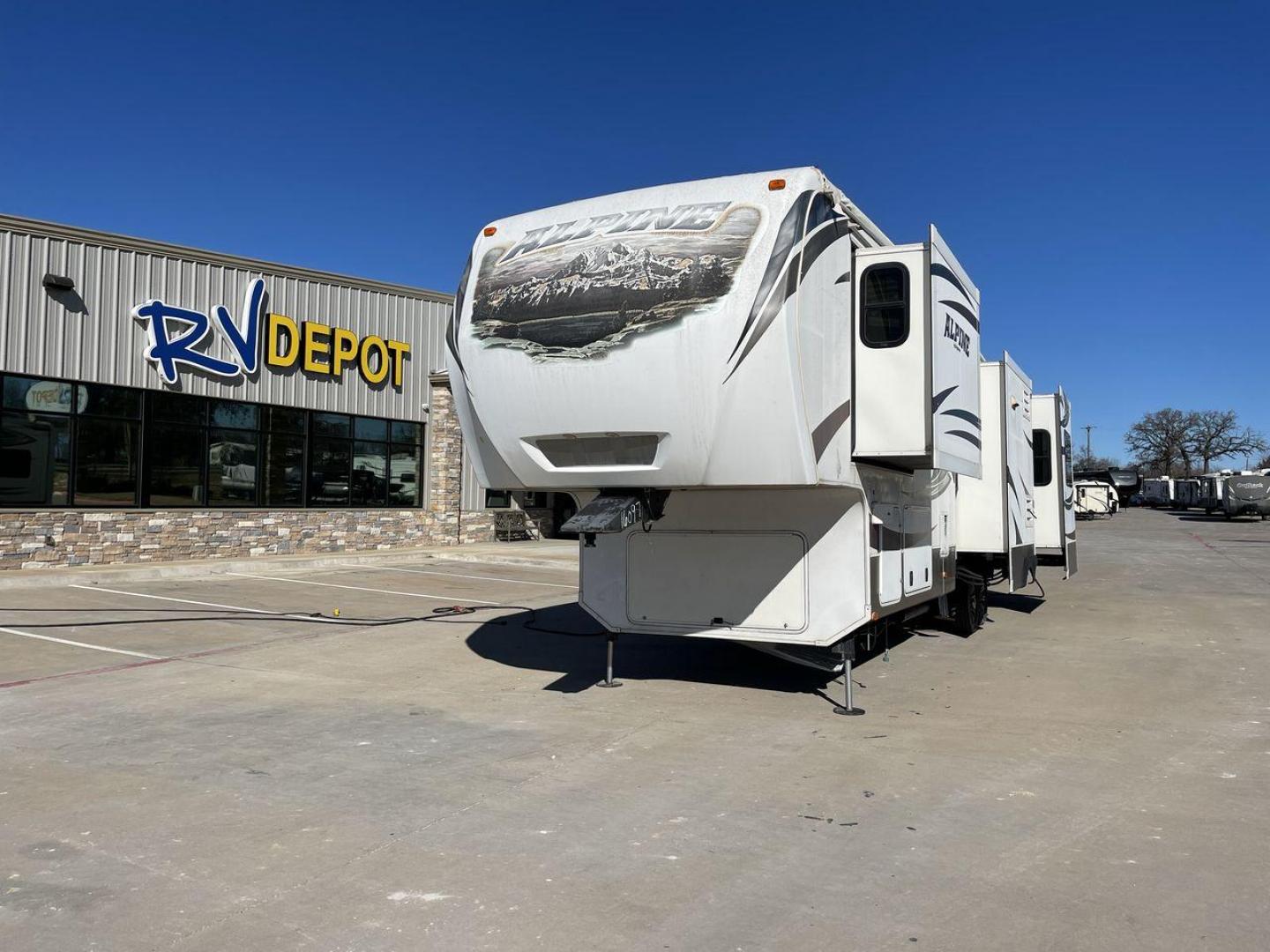 2014 WHITE ALPINE 3500RE - (4YDF35025EE) , Length: 39.17 ft. | Dry Weight: 12,379 lbs. | Gross Weight: 15,500 lbs. | Slides: 4 transmission, located at 4319 N Main Street, Cleburne, TX, 76033, (817) 221-0660, 32.435829, -97.384178 - The 2014 Alpine 3500RE fifth wheel combines style and utility. For individuals looking for a luxurious home on wheels, this RV's amenities are precisely crafted and comfort-oriented. The dimensions of this unit are 39.17 ft in length, 8 ft in width, and 12.67 ft in height. It has a dry weight of 12, - Photo#0