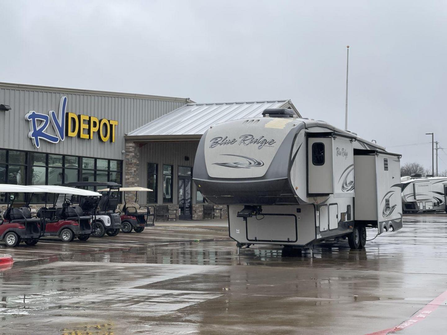 2014 TAN BLUE RIDGE 3025RL (4X4FBLF29EG) , Length: 35.5 ft. | Dry Weight: 11,614 lbs. | Gross Weight: 14,090 lbs. | Slides: 3 transmission, located at 4319 N Main Street, Cleburne, TX, 76033, (817) 221-0660, 32.435829, -97.384178 - This 2014 Forest River Fifth Wheel measures 35.5 feet long and just over 8 feet wide with a dry weight of 11,614 lbs. It has a GVWR of 14,090 lbs and a hitch weight of 2,090 lbs. This unit has automatic heating and cooling rated at 35,000 and 15,000 BTUs, respectively. The exterior of this unit is a - Photo#0