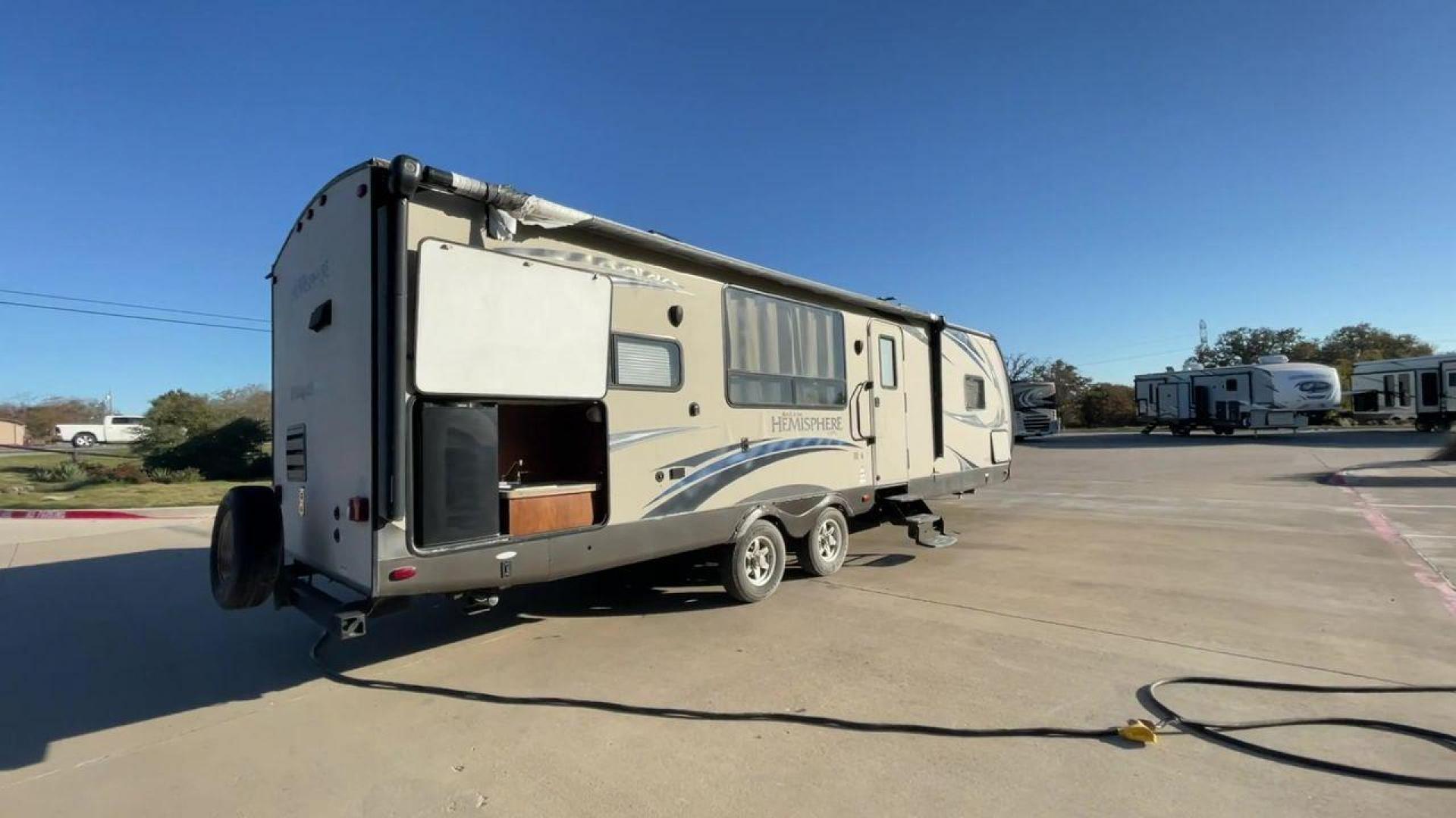 2014 TAN FOREST RIVER HEMISPHERE 282RK (4X4TSBD2XEU) , Length: 35 ft. | Dry Weight: 6,620 lbs | Gross Weight: 8,521 lbs. | Slides: 1 transmission, located at 4319 N Main Street, Cleburne, TX, 76033, (817) 221-0660, 32.435829, -97.384178 - The 2014 Forest River Hemisphere 282RK is a great travel trailer that is made to make your outdoor activities more comfortable and easy. This 35-foot trailer has a dry weight of 6,620 pounds and a gross weight of 8,521 pounds, making it easy to tow and providing plenty of space for all your gear. Th - Photo#1