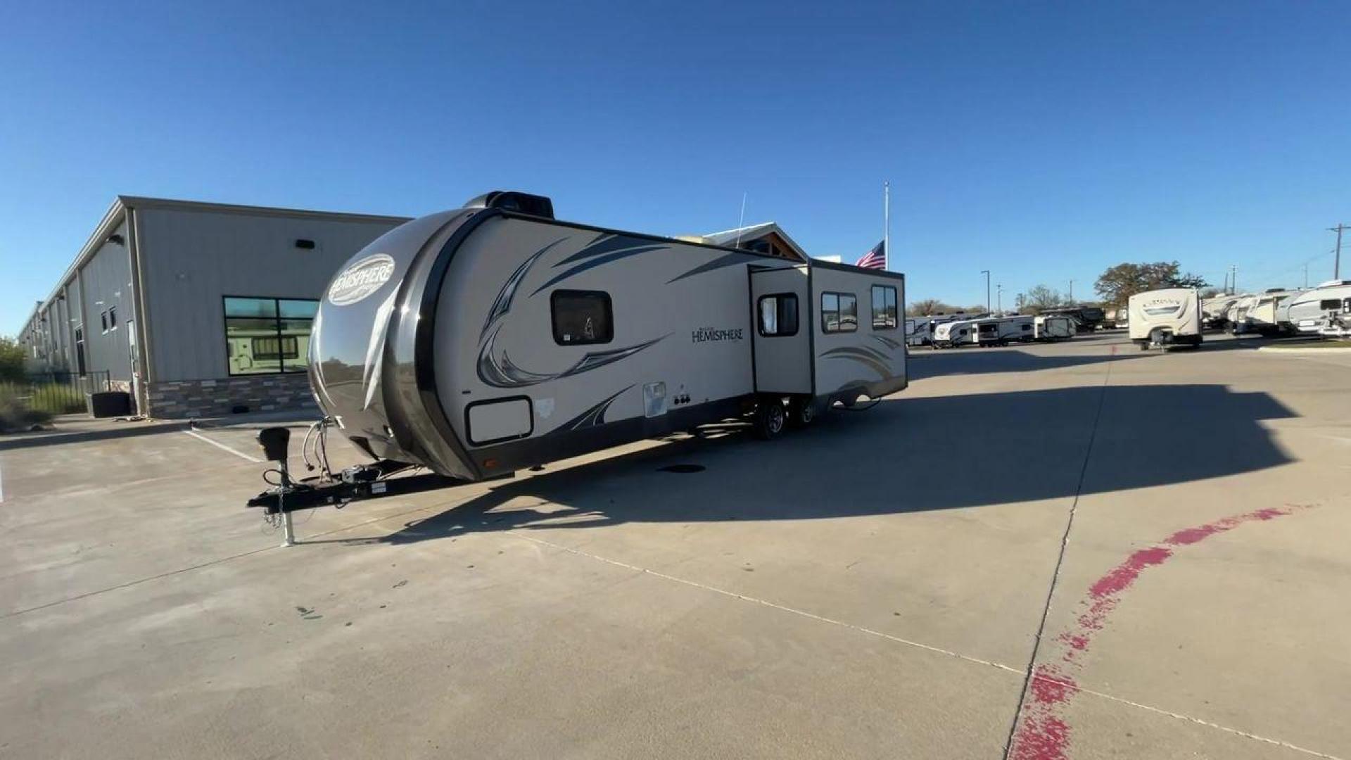 2014 TAN FOREST RIVER HEMISPHERE 282RK (4X4TSBD2XEU) , Length: 35 ft. | Dry Weight: 6,620 lbs | Gross Weight: 8,521 lbs. | Slides: 1 transmission, located at 4319 N Main Street, Cleburne, TX, 76033, (817) 221-0660, 32.435829, -97.384178 - The 2014 Forest River Hemisphere 282RK is a great travel trailer that is made to make your outdoor activities more comfortable and easy. This 35-foot trailer has a dry weight of 6,620 pounds and a gross weight of 8,521 pounds, making it easy to tow and providing plenty of space for all your gear. Th - Photo#5