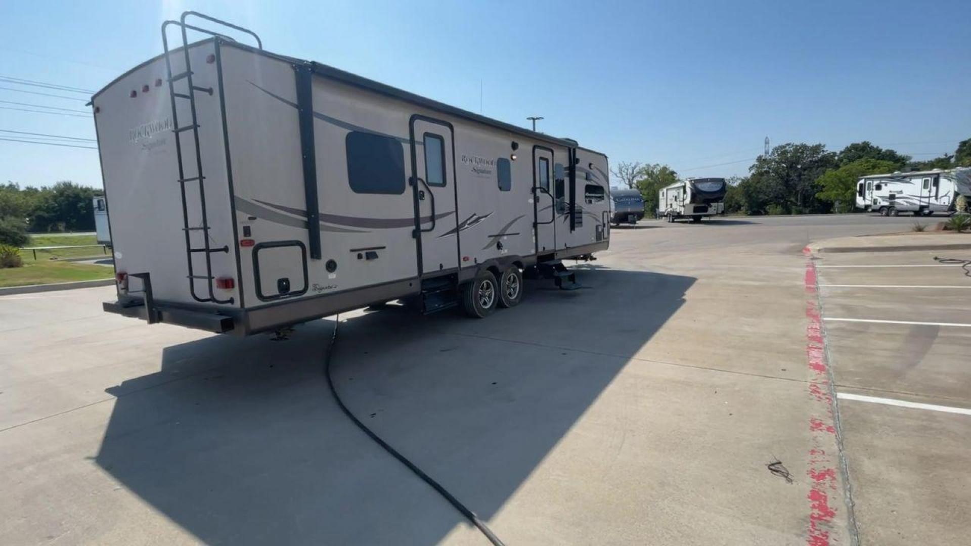 2014 WHITE FOREST RIVER ROCKWOOD 8315BBS (4X4TRLG29E1) , Length: 34.75 ft. | Dry Weight: 6,843 lbs.| Slides: 2 transmission, located at 4319 N Main Street, Cleburne, TX, 76033, (817) 221-0660, 32.435829, -97.384178 - Are you looking for a camper to accommodate the whole family and invite a few of your friends? Then the 2014 Forest River Rockwood 8315BBS travel trailer is an ideal pick for you! This camper measures just 34.75 ft in length, 8 ft in width, 9.83 ft in height, and 6.67 ft in interior height. It has a - Photo#1