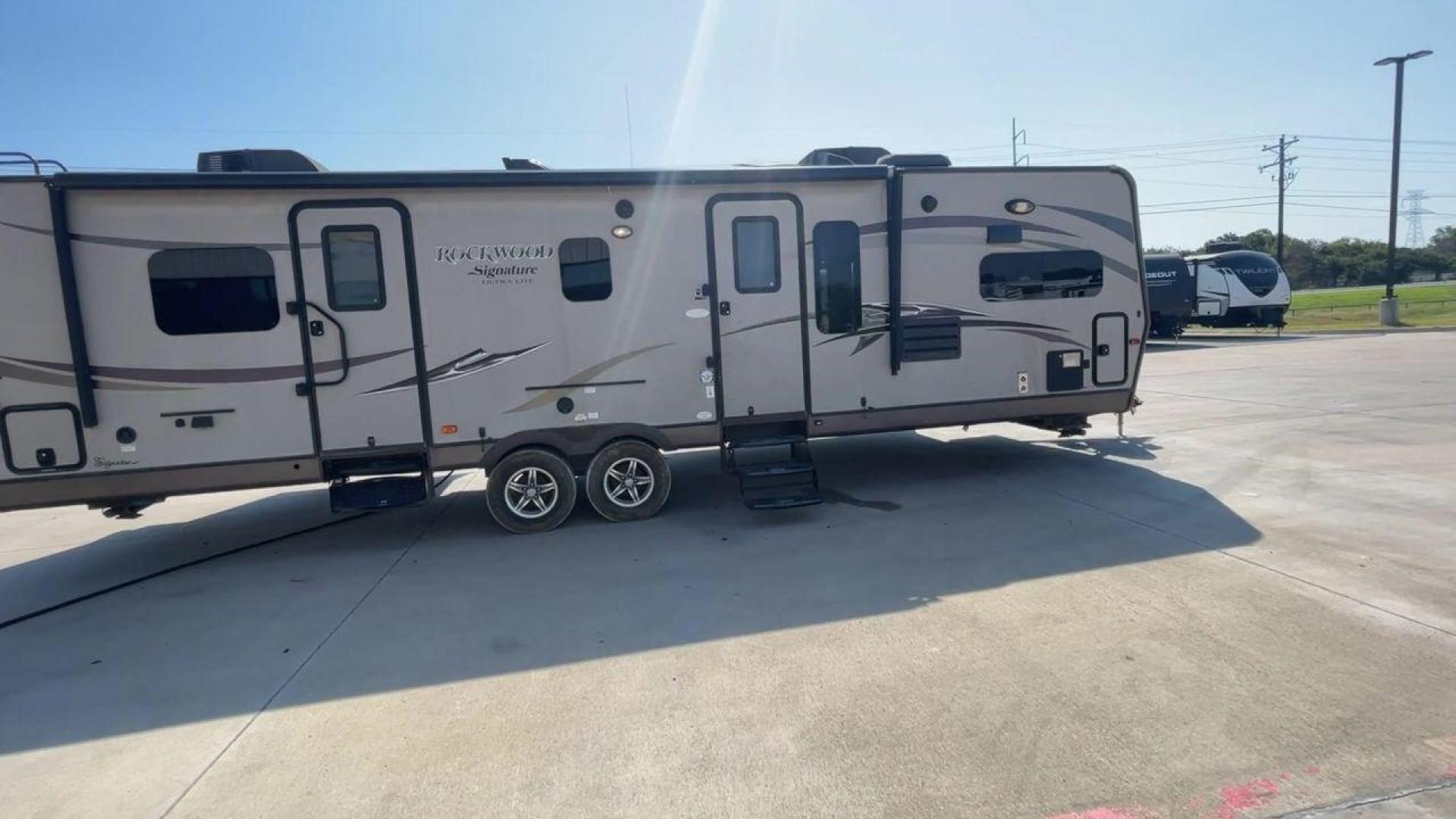 2014 WHITE FOREST RIVER ROCKWOOD 8315BBS (4X4TRLG29E1) , Length: 34.75 ft. | Dry Weight: 6,843 lbs.| Slides: 2 transmission, located at 4319 N Main Street, Cleburne, TX, 76033, (817) 221-0660, 32.435829, -97.384178 - Are you looking for a camper to accommodate the whole family and invite a few of your friends? Then the 2014 Forest River Rockwood 8315BBS travel trailer is an ideal pick for you! This camper measures just 34.75 ft in length, 8 ft in width, 9.83 ft in height, and 6.67 ft in interior height. It has a - Photo#2