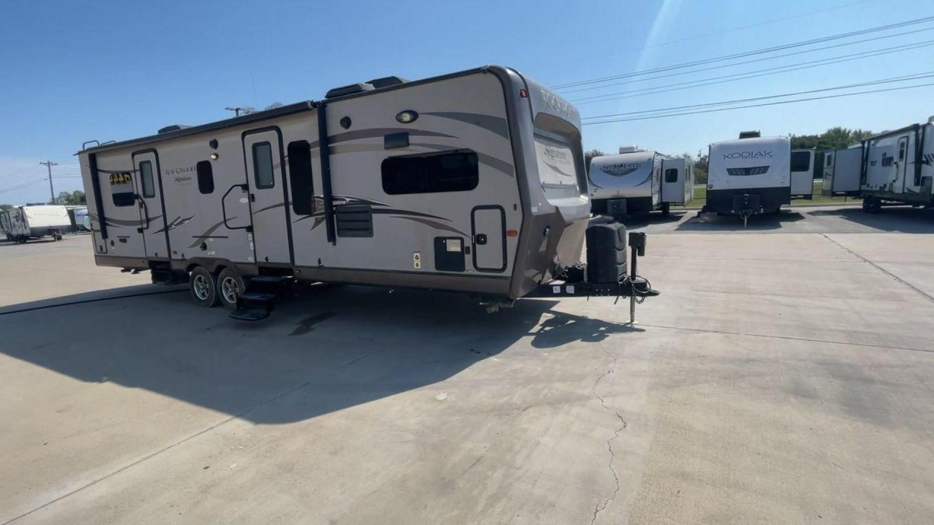 2014 WHITE FOREST RIVER ROCKWOOD 8315BBS (4X4TRLG29E1) , Length: 34.75 ft. | Dry Weight: 6,843 lbs.| Slides: 2 transmission, located at 4319 N Main Street, Cleburne, TX, 76033, (817) 221-0660, 32.435829, -97.384178 - Are you looking for a camper to accommodate the whole family and invite a few of your friends? Then the 2014 Forest River Rockwood 8315BBS travel trailer is an ideal pick for you! This camper measures just 34.75 ft in length, 8 ft in width, 9.83 ft in height, and 6.67 ft in interior height. It has a - Photo#3