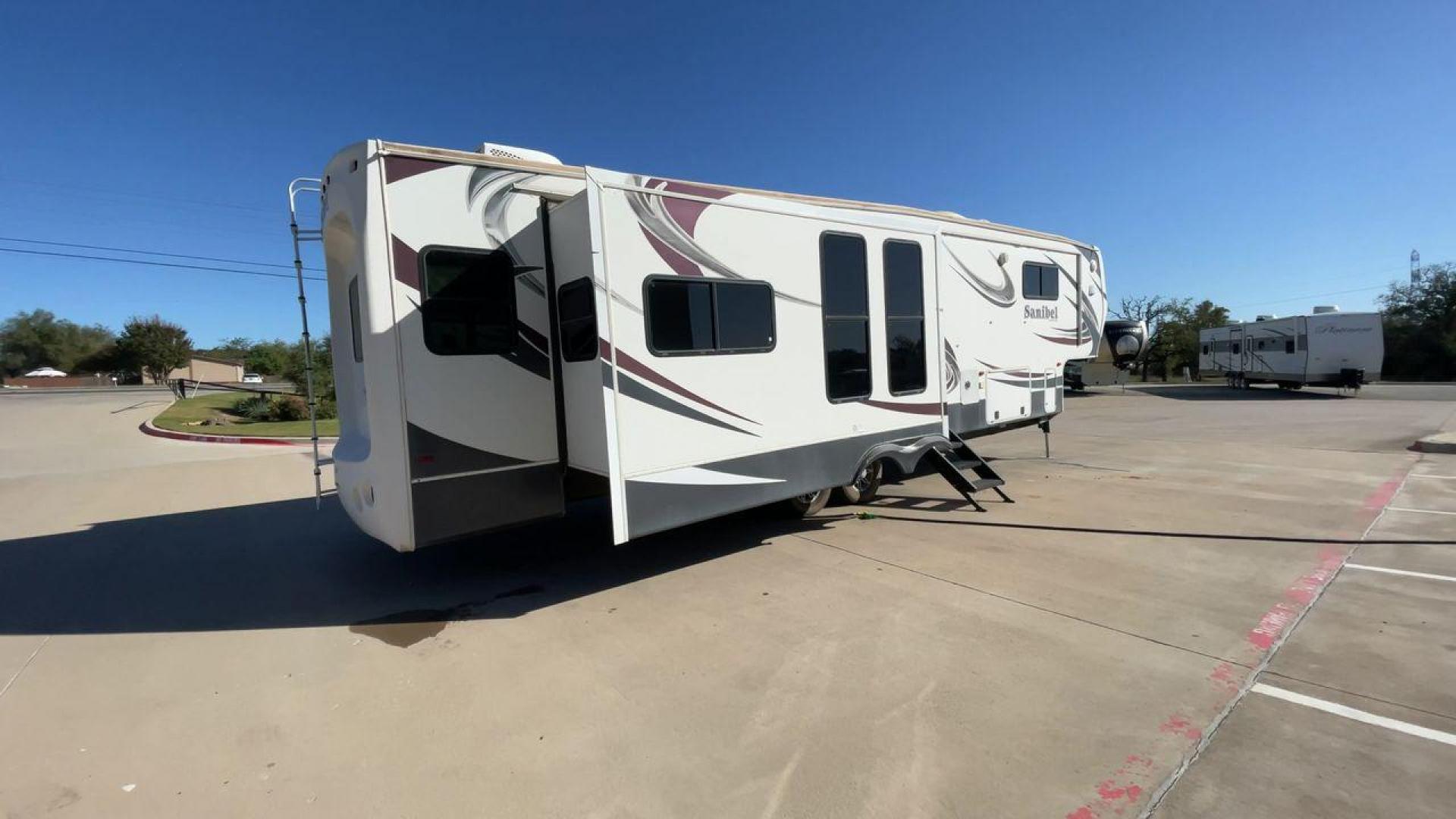 2014 WHITE FOREST RIVER SANIBEL 3600 (5ZT3SN1B8EG) , Length: 40.17 ft. | Dry Weight: 12,640 lbs. | Slides: 3 transmission, located at 4319 N Main Street, Cleburne, TX, 76033, (817) 221-0660, 32.435829, -97.384178 - The 2014 Forest River Sanibel 3600 is a dual-axle aluminum wheel set-up measuring 40.17 ft. in length. It has a dry weight of 12,640 lbs. with a payload capacity of 2,801 lbs. It is made of aluminum and fiberglass. It comes equipped with 3 power-retractable slides and a whole 18-foot power-retractab - Photo#1