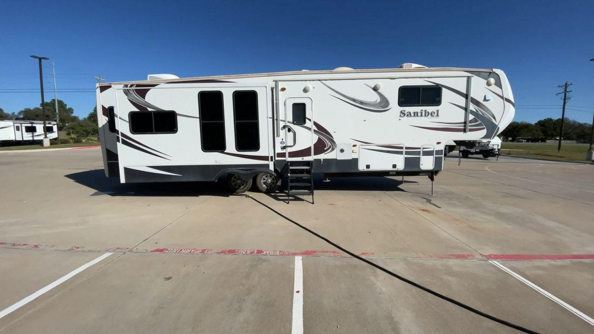 2014 WHITE FOREST RIVER SANIBEL 3600 (5ZT3SN1B8EG) , Length: 40.17 ft. | Dry Weight: 12,640 lbs. | Slides: 3 transmission, located at 4319 N Main Street, Cleburne, TX, 76033, (817) 221-0660, 32.435829, -97.384178 - The 2014 Forest River Sanibel 3600 is a dual-axle aluminum wheel set-up measuring 40.17 ft. in length. It has a dry weight of 12,640 lbs. with a payload capacity of 2,801 lbs. It is made of aluminum and fiberglass. It comes equipped with 3 power-retractable slides and a whole 18-foot power-retractab - Photo#2