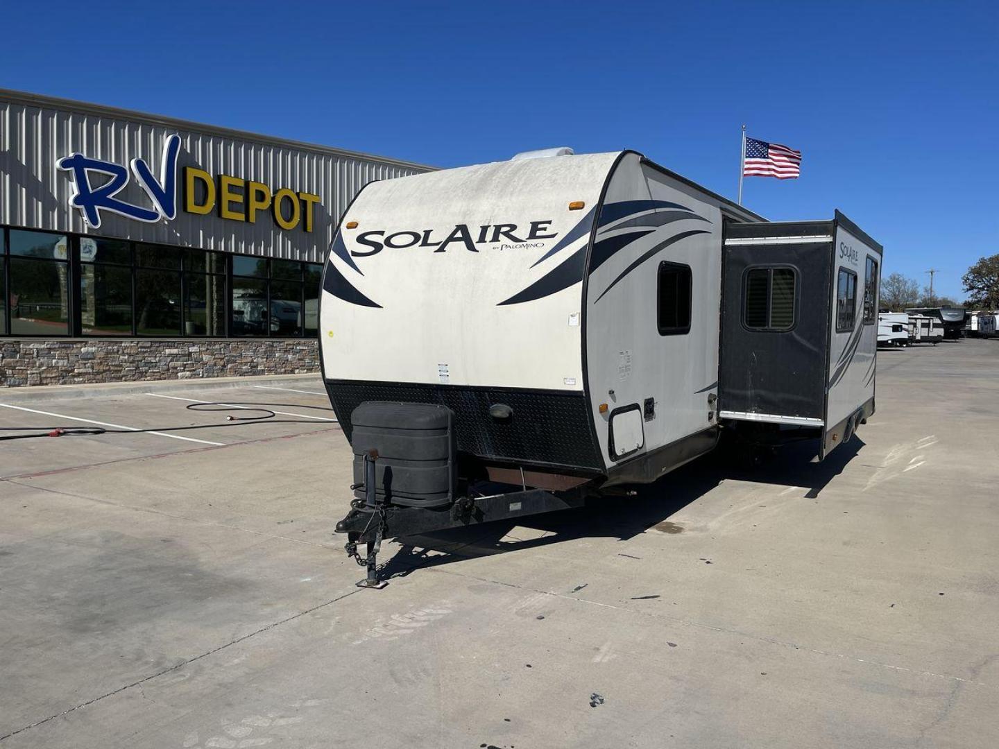 2014 BEIGE FOREST RIVER SOLAIRE 25BHSS - (4X4TPAA25EN) , located at 4319 N Main Street, Cleburne, TX, 76033, (817) 221-0660, 32.435829, -97.384178 - Here are additional factors highlighting why owning this RV is a superb choice. (1) Clocking in around 4,690 lbs, the Solaire 25BHSS is Lightweight Adventure-Ready (2) Relax under the shade and enjoy alfresco dining with the convenient awning that sets up in a flash. (3) Ditch the portable gr - Photo#0