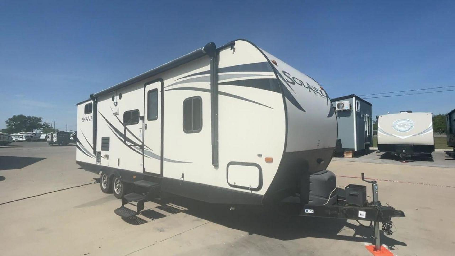 2014 TAN FOREST RIVER SOLAIRE 26RBSS (4X4TPAB28EN) , Length: 29.42 ft. | Dry Weight: 4,695 lbs. | Gross Weight: 7,570 lbs. | Slides: 1 transmission, located at 4319 N Main Street, Cleburne, TX, 76033, (817) 221-0660, 32.435829, -97.384178 - Discover extra features that contribute to making this RV an ideal investment. (1) The Solaire 26RBSS offers the advantages of being easier to tow and maneuver (2) The main living area features a U-shaped dinette and a slide-out with a sofa or dinette option (3) It also has power retractable aw - Photo#3