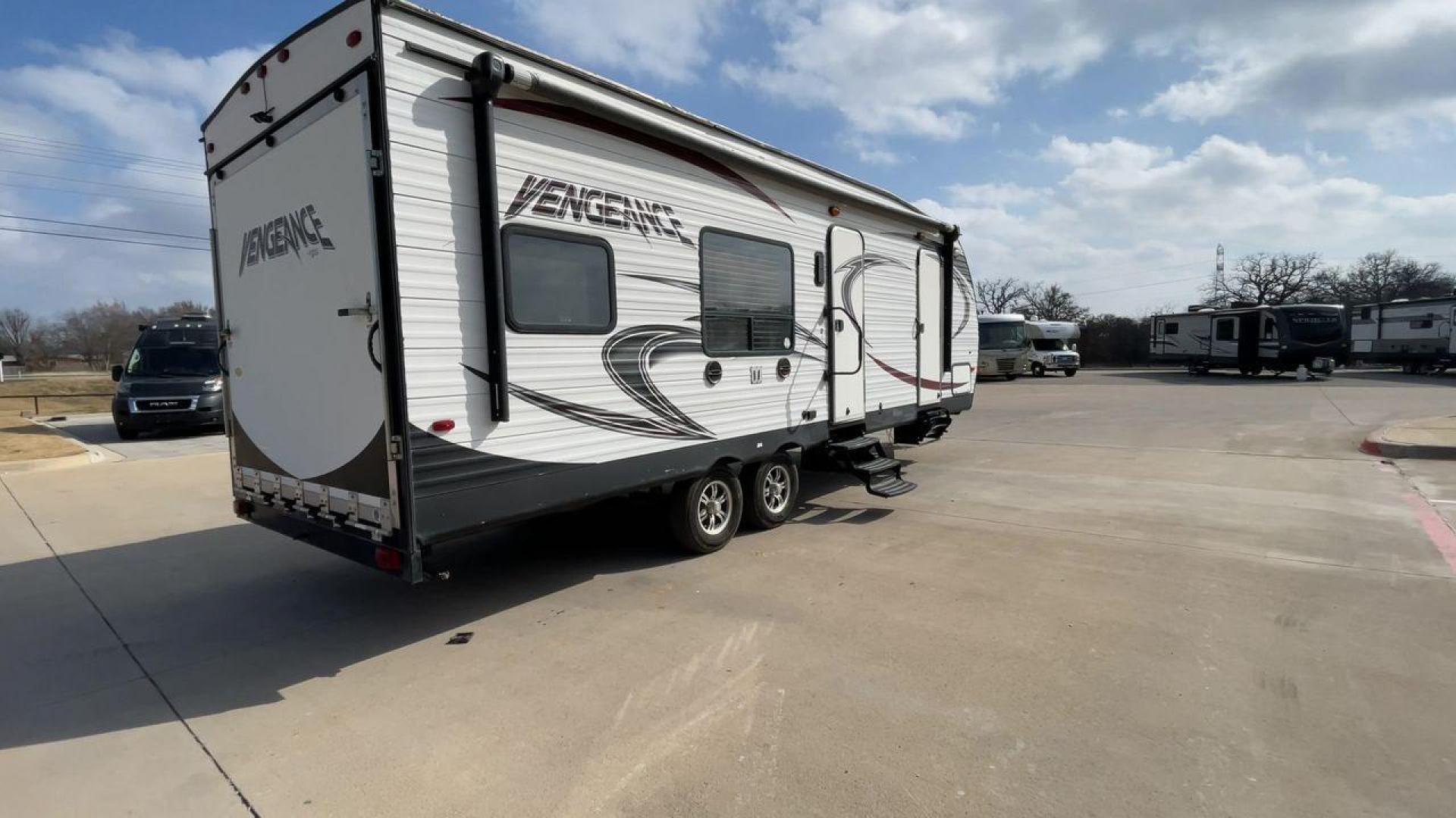 2014 WHITE FOREST RIVER VENGEANCE 25V - (4X4TVGA25EX) , Length: 30.5 ft. | Dry Weight: 6,366 lbs. | Gross Weight: 9,985 lbs. | Slides: 0 transmission, located at 4319 N Main Street, Cleburne, TX, 76033, (817) 221-0660, 32.435829, -97.384178 - The 2014 Forest River Vengeance 25V is a tough and roomy travel trailer made for people who love the outdoors and want to be comfortable and easy on their trips. This trailer provides generous living space and is conveniently lightweight, making it a breeze to tow. With its compact size, the Vengean - Photo#1