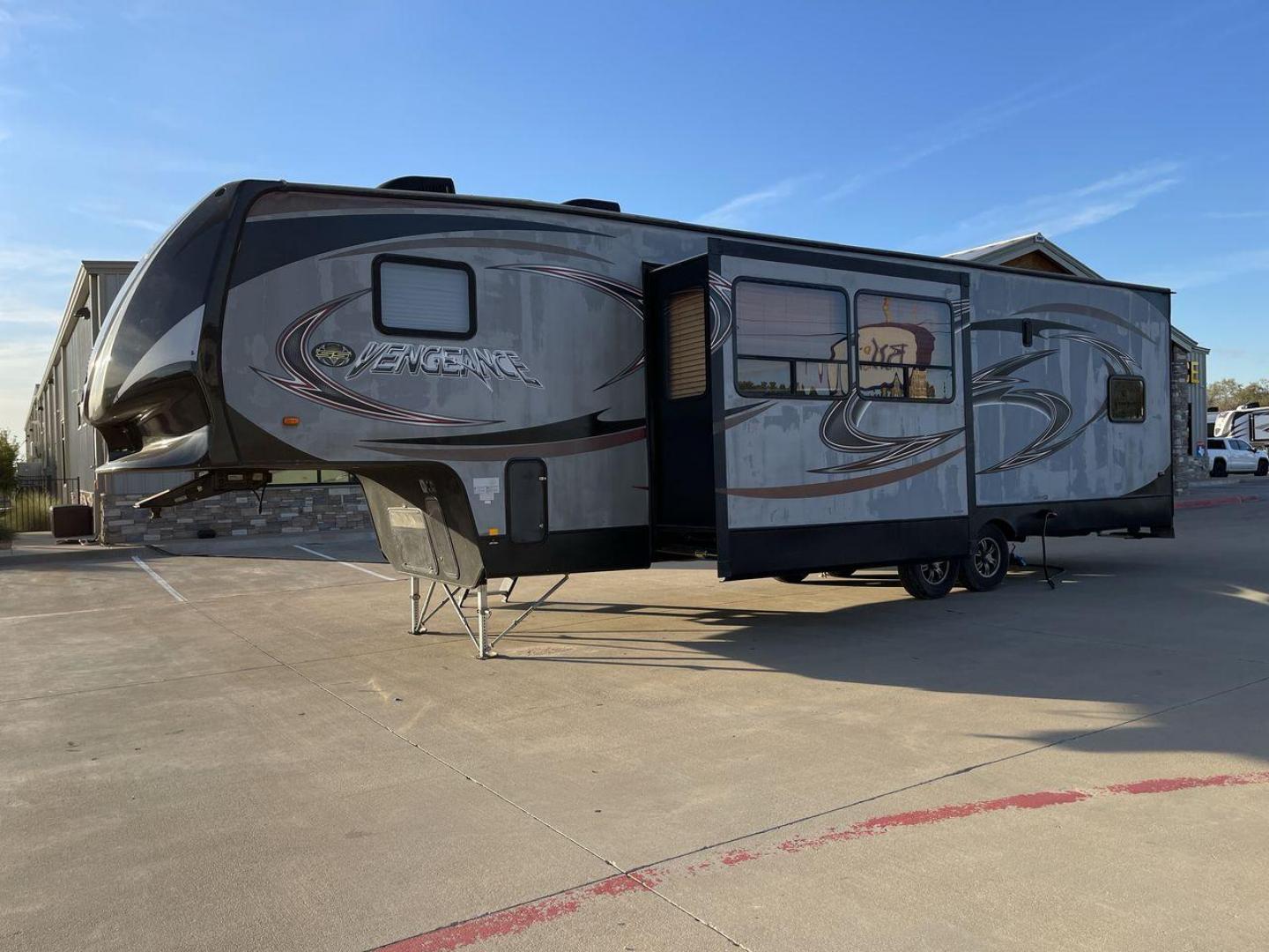 2014 WHITE FOREST RIVER VENGEANCE 312A (4X4FVGG22EY) , Length: 37.92 ft. | Dry Weight: 10,068 lbs. | Gross Weight: 14,508 lbs. | Slides: 1 transmission, located at 4319 N Main Street, Cleburne, TX, 76033, (817) 221-0660, 32.435829, -97.384178 - This 2014 Vengeance Toy Hauler has a dry weight of 10,068 lbs and a GVWR of 14,508 lbs with a hitch weight of 2,508 lbs. This unit also has automatic heating and cooling for optimal temperature control. The exterior of this toy hauler is a simple cream base with black and red accents. This model als - Photo#22