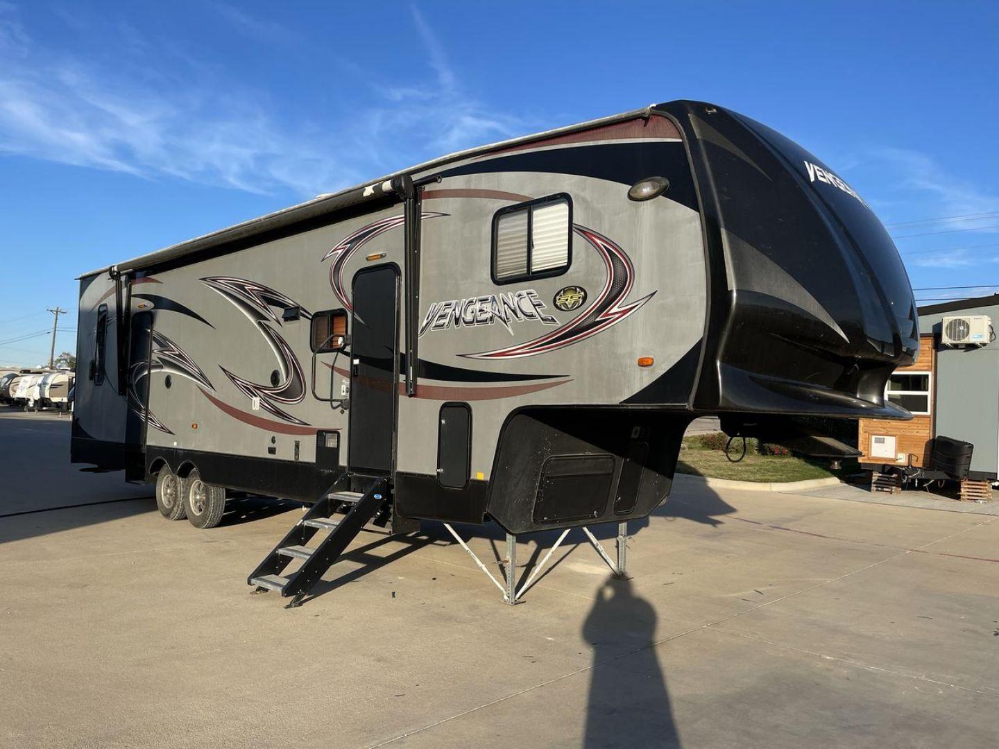 2014 WHITE FOREST RIVER VENGEANCE 312A (4X4FVGG22EY) , Length: 37.92 ft. | Dry Weight: 10,068 lbs. | Gross Weight: 14,508 lbs. | Slides: 1 transmission, located at 4319 N Main Street, Cleburne, TX, 76033, (817) 221-0660, 32.435829, -97.384178 - This 2014 Vengeance Toy Hauler has a dry weight of 10,068 lbs and a GVWR of 14,508 lbs with a hitch weight of 2,508 lbs. This unit also has automatic heating and cooling for optimal temperature control. The exterior of this toy hauler is a simple cream base with black and red accents. This model als - Photo#23