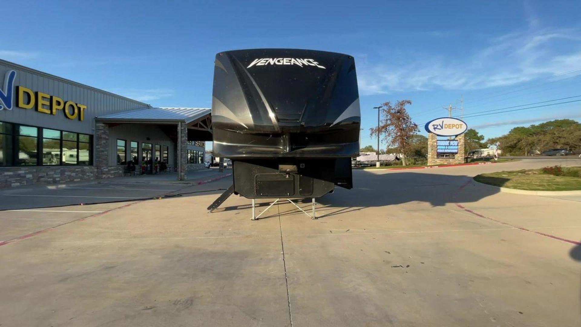 2014 WHITE FOREST RIVER VENGEANCE 312A (4X4FVGG22EY) , Length: 37.92 ft. | Dry Weight: 10,068 lbs. | Gross Weight: 14,508 lbs. | Slides: 1 transmission, located at 4319 N Main Street, Cleburne, TX, 76033, (817) 221-0660, 32.435829, -97.384178 - This 2014 Vengeance Toy Hauler has a dry weight of 10,068 lbs and a GVWR of 14,508 lbs with a hitch weight of 2,508 lbs. This unit also has automatic heating and cooling for optimal temperature control. The exterior of this toy hauler is a simple cream base with black and red accents. This model als - Photo#4