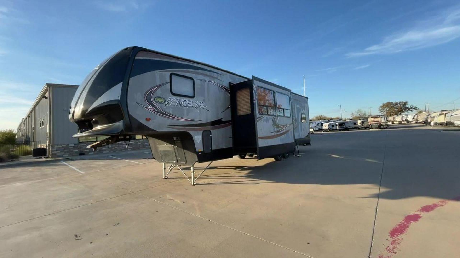 2014 WHITE FOREST RIVER VENGEANCE 312A (4X4FVGG22EY) , Length: 37.92 ft. | Dry Weight: 10,068 lbs. | Gross Weight: 14,508 lbs. | Slides: 1 transmission, located at 4319 N Main Street, Cleburne, TX, 76033, (817) 221-0660, 32.435829, -97.384178 - This 2014 Vengeance Toy Hauler has a dry weight of 10,068 lbs and a GVWR of 14,508 lbs with a hitch weight of 2,508 lbs. This unit also has automatic heating and cooling for optimal temperature control. The exterior of this toy hauler is a simple cream base with black and red accents. This model als - Photo#5