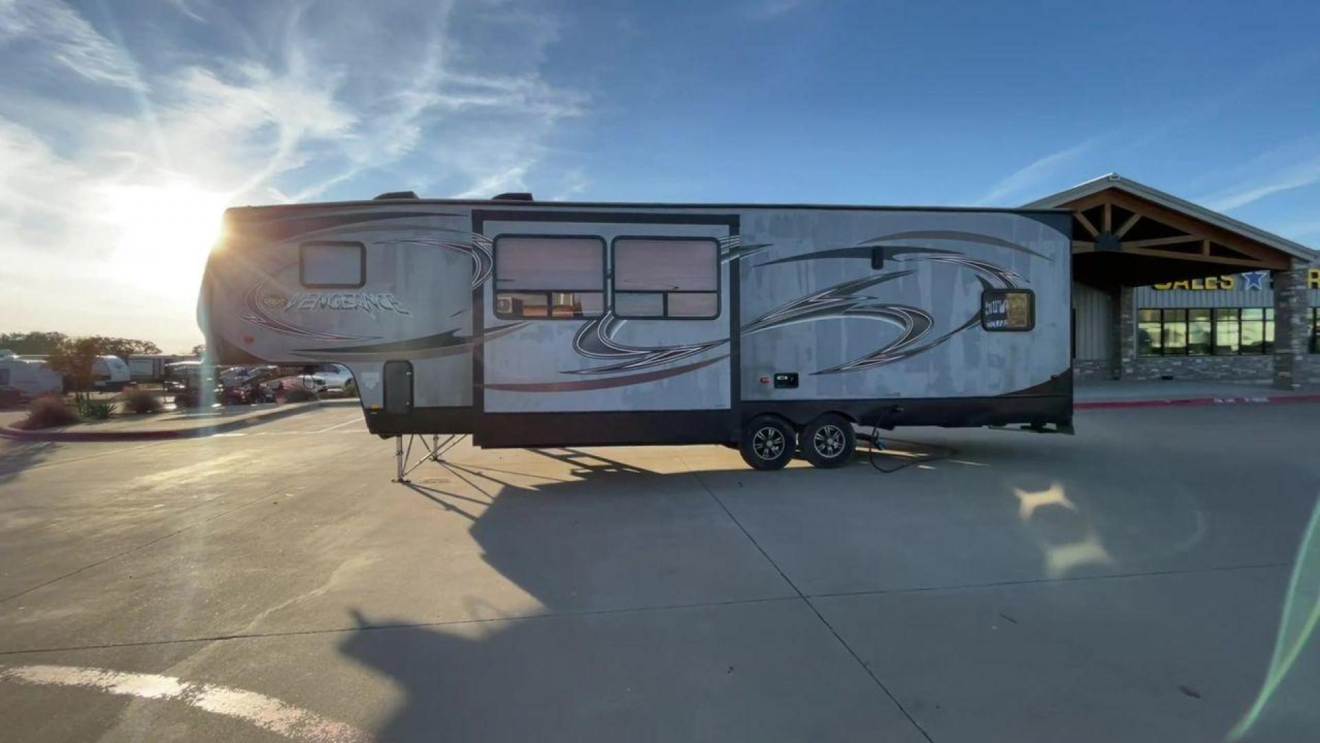 2014 WHITE FOREST RIVER VENGEANCE 312A (4X4FVGG22EY) , Length: 37.92 ft. | Dry Weight: 10,068 lbs. | Gross Weight: 14,508 lbs. | Slides: 1 transmission, located at 4319 N Main Street, Cleburne, TX, 76033, (817) 221-0660, 32.435829, -97.384178 - This 2014 Vengeance Toy Hauler has a dry weight of 10,068 lbs and a GVWR of 14,508 lbs with a hitch weight of 2,508 lbs. This unit also has automatic heating and cooling for optimal temperature control. The exterior of this toy hauler is a simple cream base with black and red accents. This model als - Photo#6