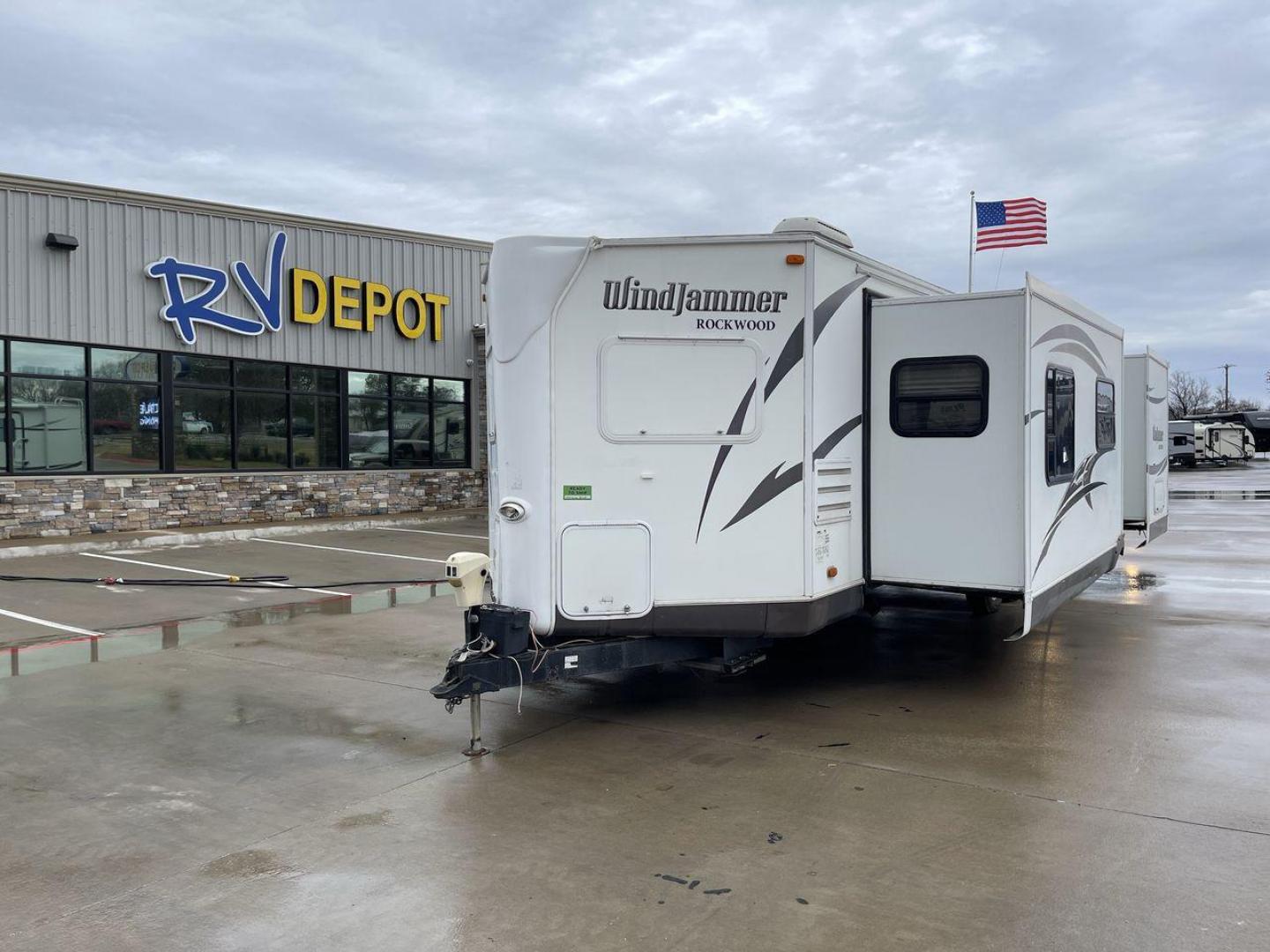 2014 WHITE FOREST RIVER WNDJMR 3008W (4X4TRLF20E1) , Length: 34.42 ft. | Dry Weight: 7,038 lbs. | Slides: 2 transmission, located at 4319 N Main Street, Cleburne, TX, 76033, (817) 221-0660, 32.435829, -97.384178 - This 2014 Forest River WNDJMR 3008W travel trailer is painted in a stunning white exterior color, giving it a sleek and modern look. It embodies the perfect balance of comfort, functionality, and style, making it an ideal choice for both seasoned travelers and those embarking on their first RV adven - Photo#0