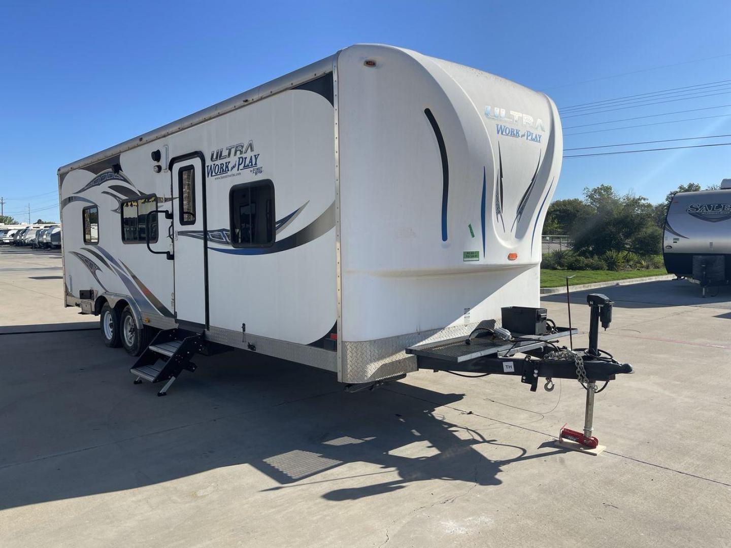 2014 WHITE FOREST RIVER WORK AND PLAY 25UDT (4X4TWPA21EB) , Length: 30.42 ft. | Dry Weight: 6,201 lbs. | Gross Weight: 9,987 lbs. | Slides: 0 transmission, located at 4319 N Main Street, Cleburne, TX, 76033, (817) 221-0660, 32.435829, -97.384178 - With the 2014 Forest River Work and Play 25UDT Toy Hauler, unleash the excitement of exploration. For people who want the comforts of home away from home combined with the excitement of outdoor activities, this tough and adaptable RV is ideal. The dimensions of this toy hauler are 30.42 ft in len - Photo#22