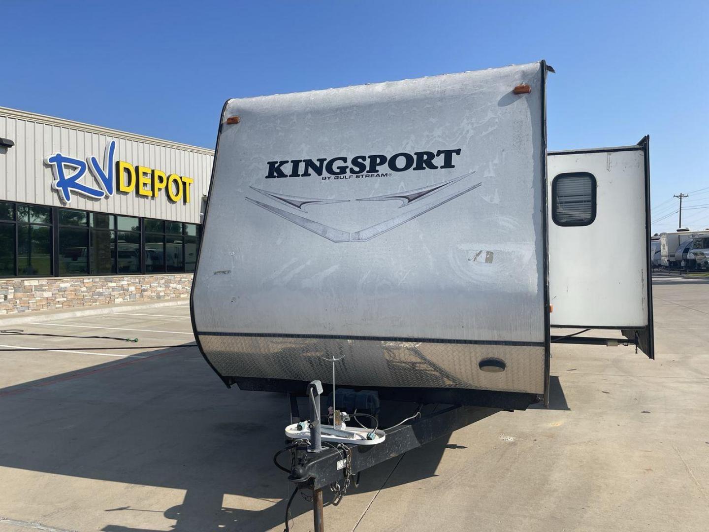 2014 WHITE GULFSTREAM KINGSPORT 265BHG (1NL1GTM28E1) , Length: 28.92 ft. | Dry Weight: 6,000 lbs. | Slides: 1 transmission, located at 4319 N Main Street, Cleburne, TX, 76033, (817) 221-0660, 32.435829, -97.384178 - With the 2014 Gulf Stream Kingsport 265BHG Travel Trailer, go out on your camping excursions. This travel trailer, built for ease and comfort, provides a flexible and luxurious living area for wonderful outdoor adventures. This unit has dimensions of 28.92 ft in length, 8 ft in width, and 10.75 f - Photo#0