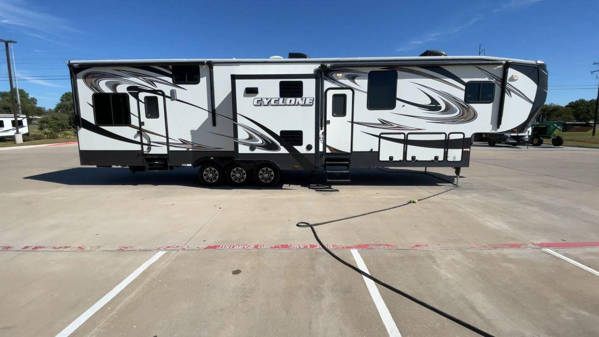 2014 HEARTLAND CYCLONE 4100 (5SFCG4330EE) , Length: 43.7 ft. | Dry Weight: 14,595 lbs. | Gross Weight: 18,000 lbs. | Slides: 3 transmission, located at 4319 N Main Street, Cleburne, TX, 76033, (817) 221-0660, 32.435829, -97.384178 - Photo#2