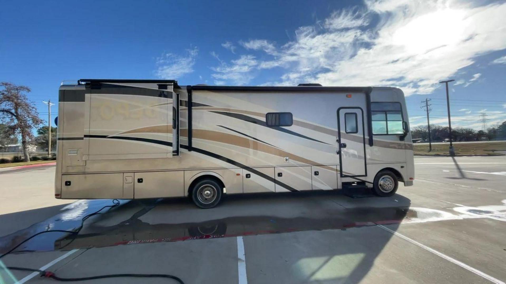 2014 BROWN HOLIDAY RAMBLER VACATIONER 33SFD - (1F66F5DY0D0) with an 6.8L V10 SOHC 30V engine, Length: 35 ft. | Slides: 2 transmission, located at 4319 N Main Street, Cleburne, TX, 76033, (817) 221-0660, 32.435829, -97.384178 - The 2014 Holiday Rambler Vacationer 33SFD is a premium Class A motorhome that blends comfort and style for an unparalleled travel experience. This meticulously designed model is built on a Ford F53 chassis, powered by a robust Triton V10 engine to ensure a smooth and powerful ride. The Vacationer 33 - Photo#2