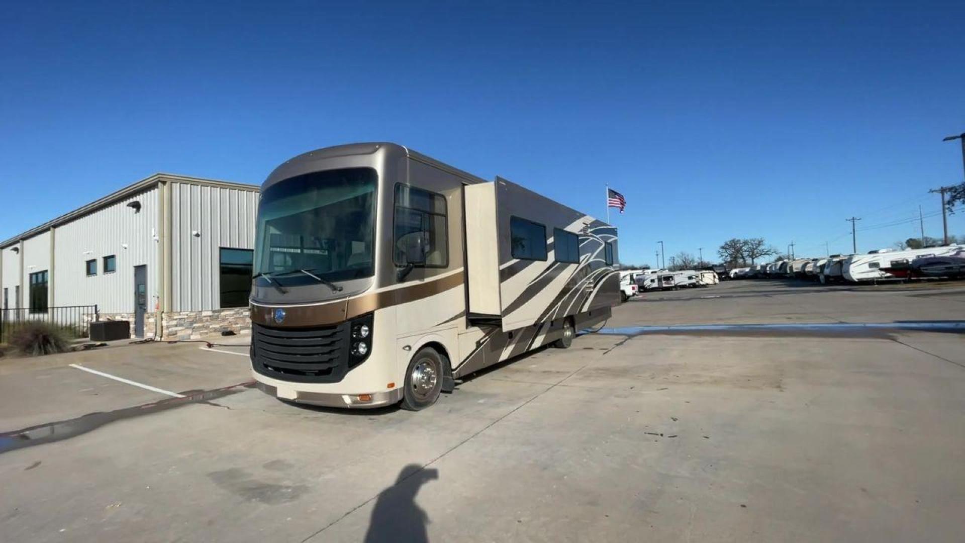 2014 BROWN HOLIDAY RAMBLER VACATIONER 33SFD - (1F66F5DY0D0) with an 6.8L V10 SOHC 30V engine, Length: 35 ft. | Slides: 2 transmission, located at 4319 N Main Street, Cleburne, TX, 76033, (817) 221-0660, 32.435829, -97.384178 - The 2014 Holiday Rambler Vacationer 33SFD is a premium Class A motorhome that blends comfort and style for an unparalleled travel experience. This meticulously designed model is built on a Ford F53 chassis, powered by a robust Triton V10 engine to ensure a smooth and powerful ride. The Vacationer 33 - Photo#5