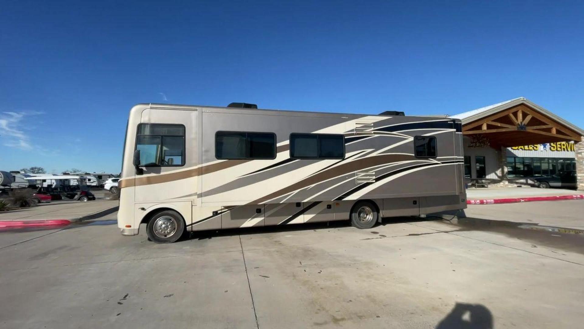 2014 BROWN HOLIDAY RAMBLER VACATIONER 33SFD - (1F66F5DY0D0) with an 6.8L V10 SOHC 30V engine, Length: 35 ft. | Slides: 2 transmission, located at 4319 N Main Street, Cleburne, TX, 76033, (817) 221-0660, 32.435829, -97.384178 - The 2014 Holiday Rambler Vacationer 33SFD is a premium Class A motorhome that blends comfort and style for an unparalleled travel experience. This meticulously designed model is built on a Ford F53 chassis, powered by a robust Triton V10 engine to ensure a smooth and powerful ride. The Vacationer 33 - Photo#6