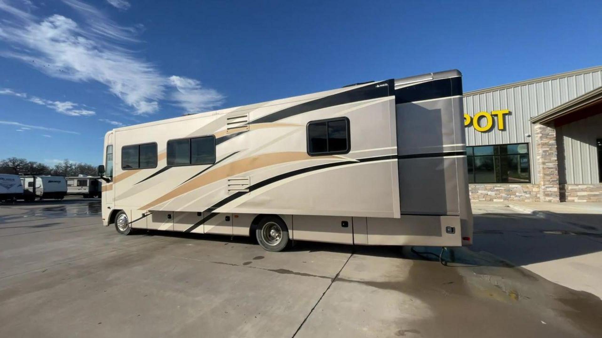 2014 BROWN HOLIDAY RAMBLER VACATIONER 33SFD - (1F66F5DY0D0) with an 6.8L V10 SOHC 30V engine, Length: 35 ft. | Slides: 2 transmission, located at 4319 N Main Street, Cleburne, TX, 76033, (817) 221-0660, 32.435829, -97.384178 - The 2014 Holiday Rambler Vacationer 33SFD is a premium Class A motorhome that blends comfort and style for an unparalleled travel experience. This meticulously designed model is built on a Ford F53 chassis, powered by a robust Triton V10 engine to ensure a smooth and powerful ride. The Vacationer 33 - Photo#7