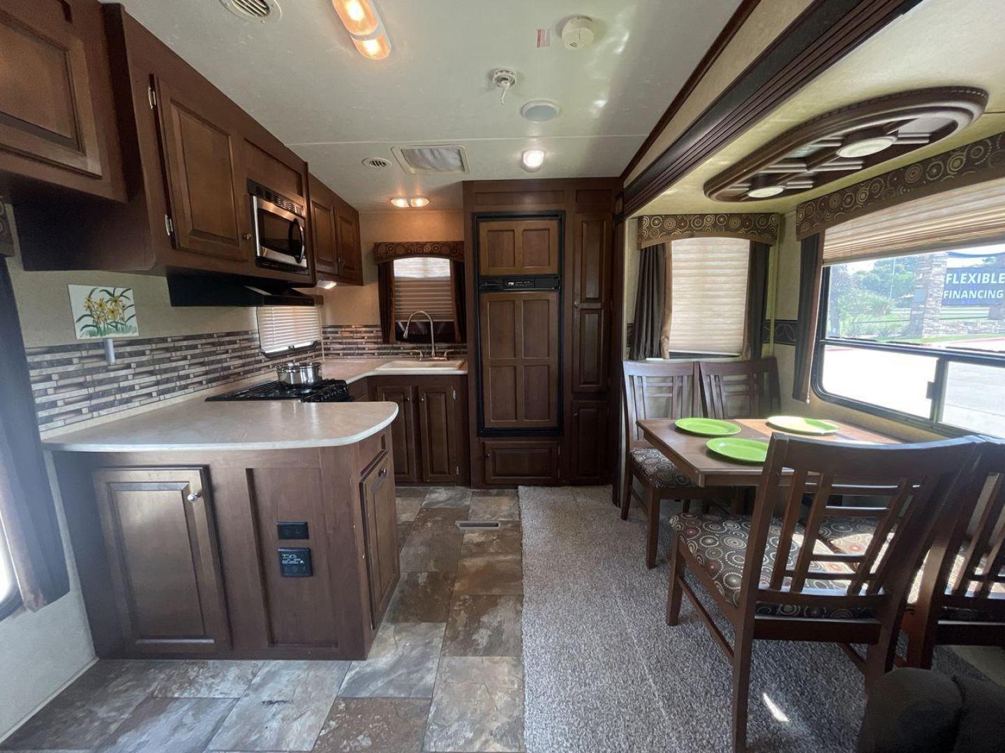 2014 WHITE JAYCO EAGLE 285RKDS (1UJCJ0BP7E2) , located at 4319 N Main Street, Cleburne, TX, 76033, (817) 221-0660, 32.435829, -97.384178 - This 2014 Jayco Eagle Fifth Wheel measures just over 32 feet tall and 8 feet wide with a dry weight of 8,390 lbs. It has a GVWR of 10,500 lbs and a hitch weight of 1,725 lbs. This unit also comes with standard automatic heating and automatic cooling rated at 13,500 BTUs. The exterior of this model i - Photo#13