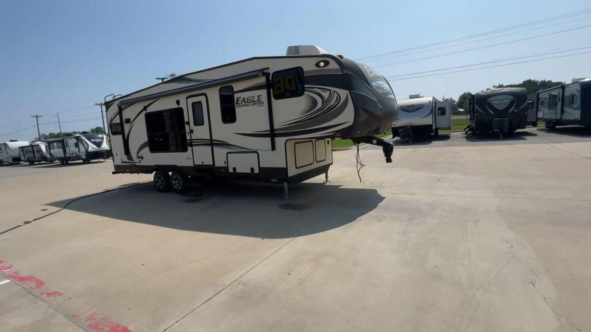 2014 WHITE JAYCO EAGLE 285RKDS (1UJCJ0BP7E2) , located at 4319 N Main Street, Cleburne, TX, 76033, (817) 221-0660, 32.435829, -97.384178 - This 2014 Jayco Eagle Fifth Wheel measures just over 32 feet tall and 8 feet wide with a dry weight of 8,390 lbs. It has a GVWR of 10,500 lbs and a hitch weight of 1,725 lbs. This unit also comes with standard automatic heating and automatic cooling rated at 13,500 BTUs. The exterior of this model i - Photo#3