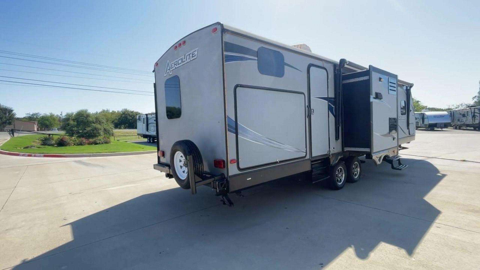 2014 KEYSTONE AEROLITE 319BHSS (47CTAET21EK) , Length: 36.92 ft. | Dry Weight: 8,084 lbs. | Slides: 3 transmission, located at 4319 N Main Street, Cleburne, TX, 76033, (817) 221-0660, 32.435829, -97.384178 - The 2014 Keystone Aerolite 319BHSS is an expansive 36.92-foot travel trailer that offers comfort and convenience for long-term travel or weekend getaways. With a dry weight of 8,084 lbs. and three slides, it provides ample space for the entire family. Upon entering, you're greeted by a beautifully d - Photo#1