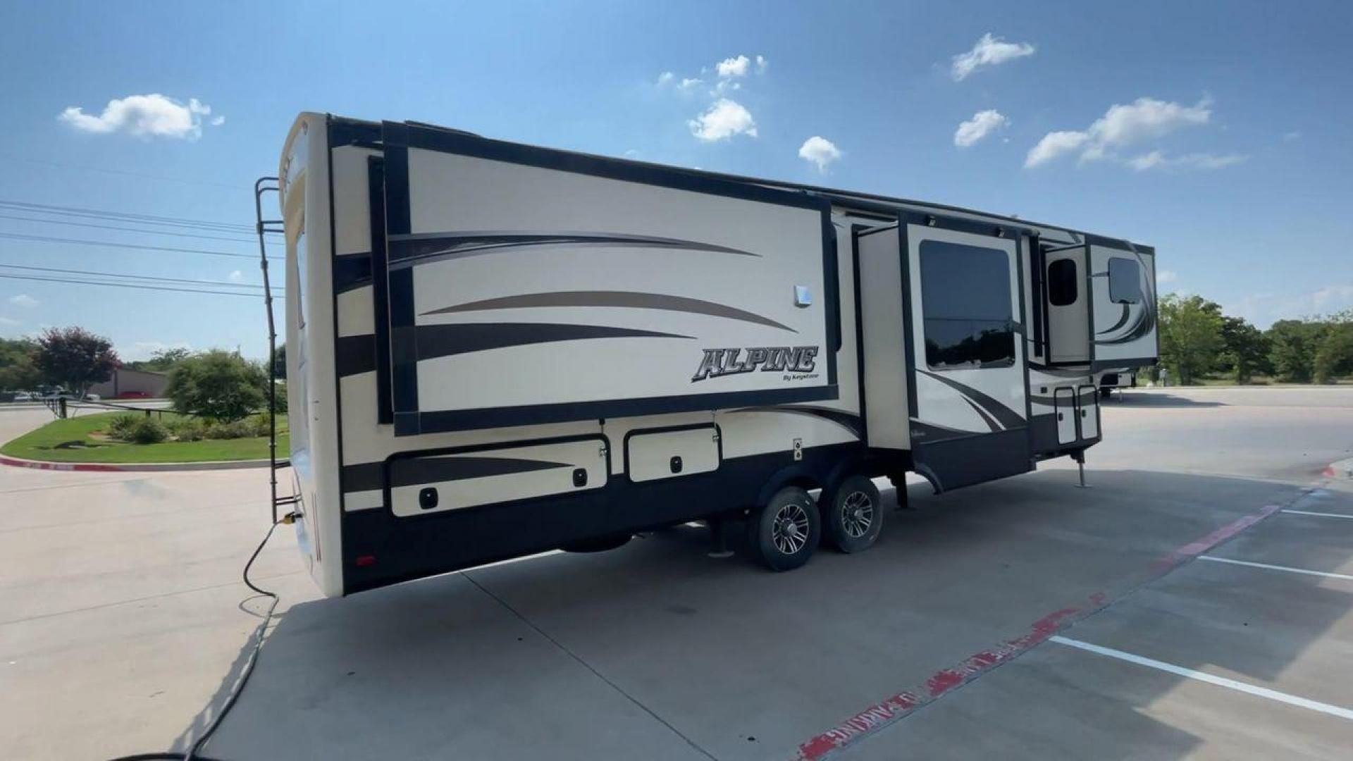 2014 GRAY KEYSTONE ALPINE 3620FL (4YDF36222EE) , Length: 39.08 ft. | Dry Weight: 12,370 lbs. | Gross Weight: 15,500 lbs. | Slides: 6 transmission, located at 4319 N Main Street, Cleburne, TX, 76033, (817) 221-0660, 32.435829, -97.384178 - Experience the 2014 Alpine 3620FL fifth wheel, the pinnacle of comfort and elegance. This RV, painstakingly designed and built by Alpine, provides the best possible fifth wheel travel experience for individuals who want nothing less. The dimensions of this unit are 39.08 ft in length, 8 ft in width, - Photo#1