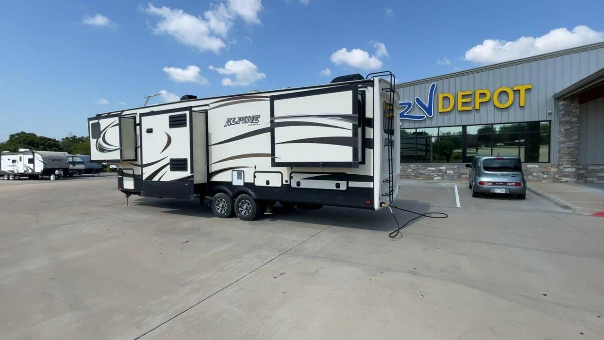 2014 GRAY KEYSTONE ALPINE 3620FL (4YDF36222EE) , Length: 39.08 ft. | Dry Weight: 12,370 lbs. | Gross Weight: 15,500 lbs. | Slides: 6 transmission, located at 4319 N Main Street, Cleburne, TX, 76033, (817) 221-0660, 32.435829, -97.384178 - Experience the 2014 Alpine 3620FL fifth wheel, the pinnacle of comfort and elegance. This RV, painstakingly designed and built by Alpine, provides the best possible fifth wheel travel experience for individuals who want nothing less. The dimensions of this unit are 39.08 ft in length, 8 ft in width, - Photo#7