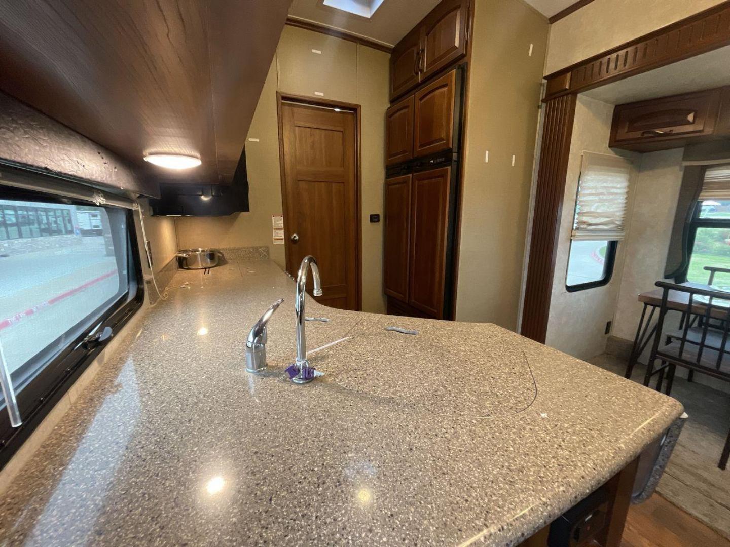 2014 WHITE KEYSTONE MONTANA 3750FL (4YDF37522E4) , located at 4319 N Main Street, Cleburne, TX, 76033, (817) 221-0660, 32.435829, -97.384178 - This 2014 Montana 3750FL fifth wheel measures just over 38' in length. It is a dual axle, aluminum wheel setup with a dry weight of 12,597 lbs and has a carrying capacity of 3,173 lbs. This fifth wheel has five slides. The rear of the fifth wheel holds the bedroom. It has a queen sized bed with a - Photo#27