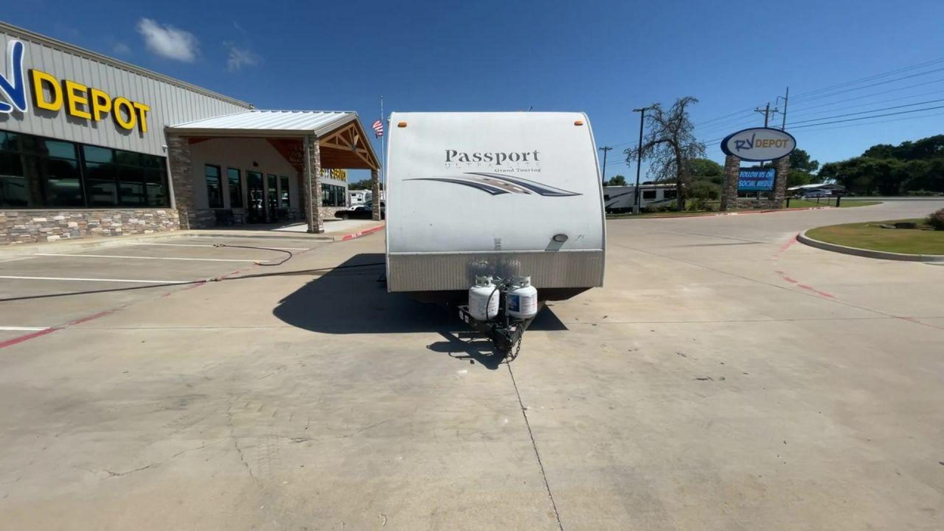 2014 WHITE KEYSTONE PASSPORT 2400BH (4YDT24029ET) , Length: 27.83 ft. | Dry Weight: 4,730 lbs. | Gross Weight: 6,800 lbs. | Slides: 1 transmission, located at 4319 N Main Street, Cleburne, TX, 76033, (817) 221-0660, 32.435829, -97.384178 - The 2014 Keystone Passport 2400BH is a dual-axle steel wheel set-up that measures 27.83 ft. in length. It has a dry weight of 4,730 lbs. and a GVWR of 6,800 lbs. It also has a payload capacity of 2,070 lbs. and a hitch weight of 515 lbs. Its exterior is a base color of white with black and brown acc - Photo#4