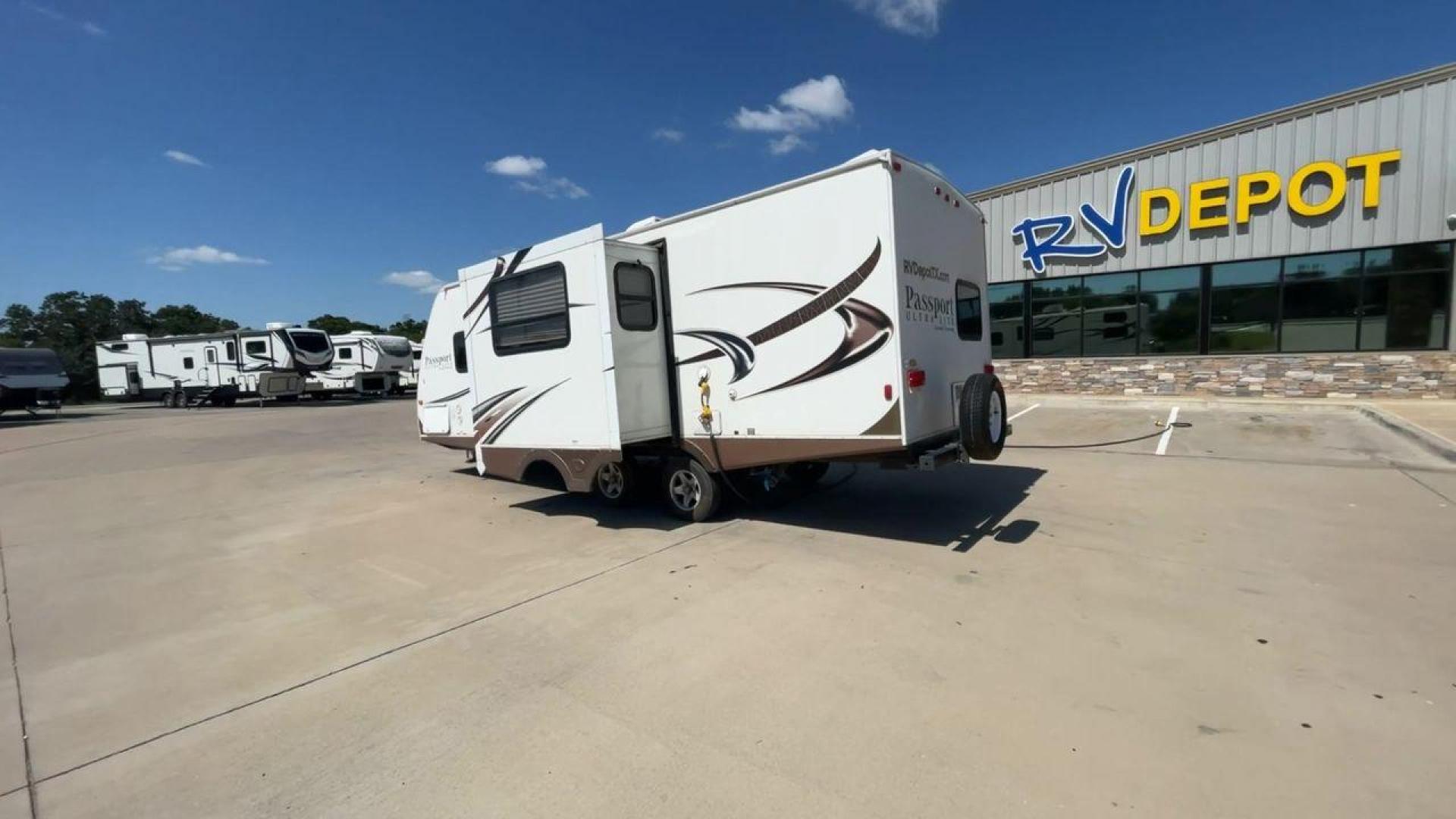 2014 WHITE KEYSTONE PASSPORT 2400BH (4YDT24029ET) , Length: 27.83 ft. | Dry Weight: 4,730 lbs. | Gross Weight: 6,800 lbs. | Slides: 1 transmission, located at 4319 N Main Street, Cleburne, TX, 76033, (817) 221-0660, 32.435829, -97.384178 - The 2014 Keystone Passport 2400BH is a dual-axle steel wheel set-up that measures 27.83 ft. in length. It has a dry weight of 4,730 lbs. and a GVWR of 6,800 lbs. It also has a payload capacity of 2,070 lbs. and a hitch weight of 515 lbs. Its exterior is a base color of white with black and brown acc - Photo#7