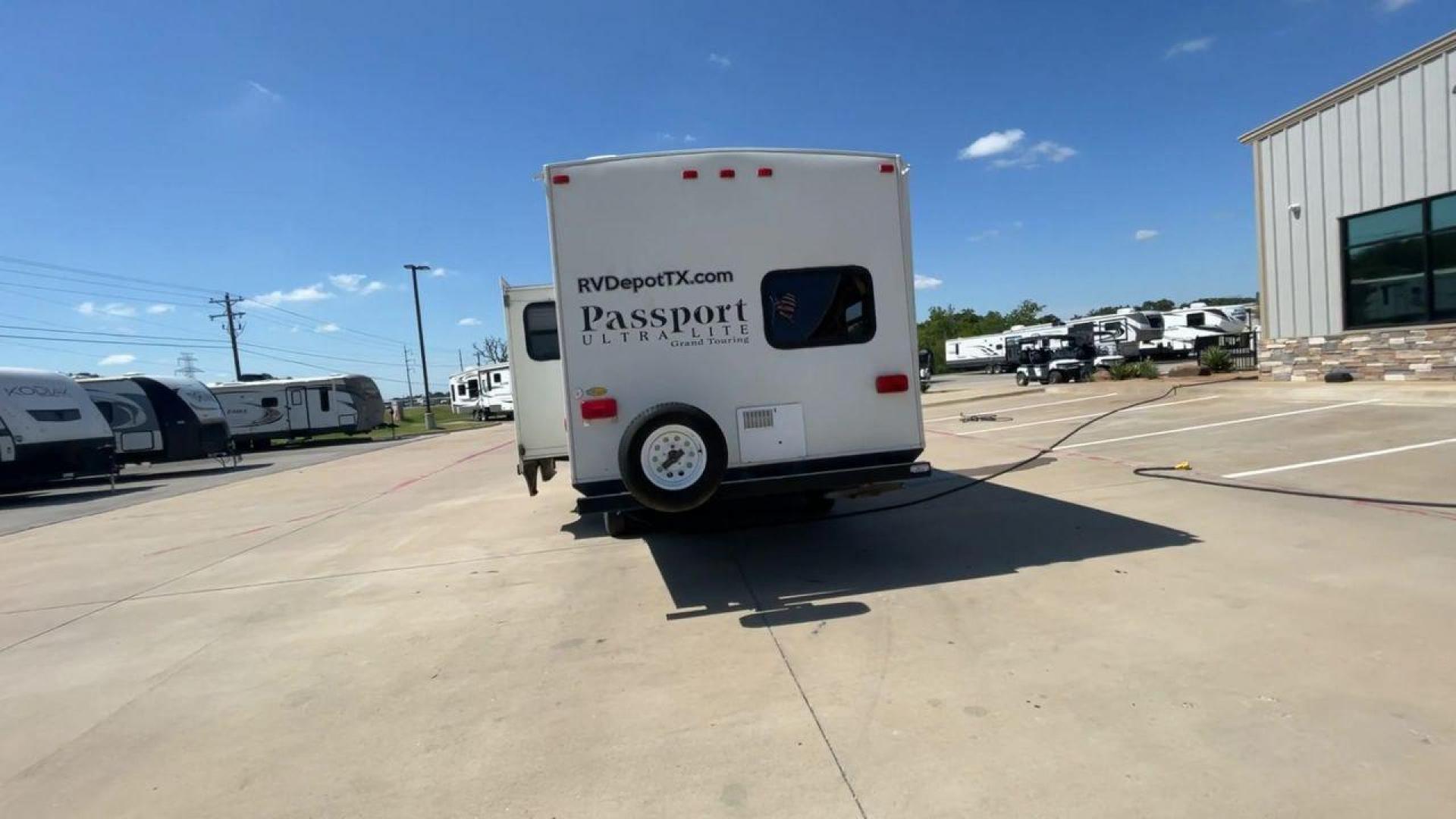 2014 WHITE KEYSTONE PASSPORT 2400BH (4YDT24029ET) , Length: 27.83 ft. | Dry Weight: 4,730 lbs. | Gross Weight: 6,800 lbs. | Slides: 1 transmission, located at 4319 N Main Street, Cleburne, TX, 76033, (817) 221-0660, 32.435829, -97.384178 - The 2014 Keystone Passport 2400BH is a dual-axle steel wheel set-up that measures 27.83 ft. in length. It has a dry weight of 4,730 lbs. and a GVWR of 6,800 lbs. It also has a payload capacity of 2,070 lbs. and a hitch weight of 515 lbs. Its exterior is a base color of white with black and brown acc - Photo#8