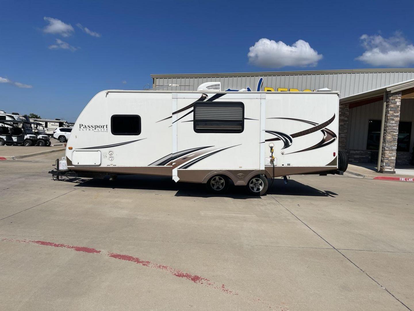 2014 WHITE KEYSTONE PASSPORT 2400BH (4YDT24029ET) , Length: 27.83 ft. | Dry Weight: 4,730 lbs. | Gross Weight: 6,800 lbs. | Slides: 1 transmission, located at 4319 N Main Street, Cleburne, TX, 76033, (817) 221-0660, 32.435829, -97.384178 - The 2014 Keystone Passport 2400BH is a dual-axle steel wheel set-up that measures 27.83 ft. in length. It has a dry weight of 4,730 lbs. and a GVWR of 6,800 lbs. It also has a payload capacity of 2,070 lbs. and a hitch weight of 515 lbs. Its exterior is a base color of white with black and brown acc - Photo#24