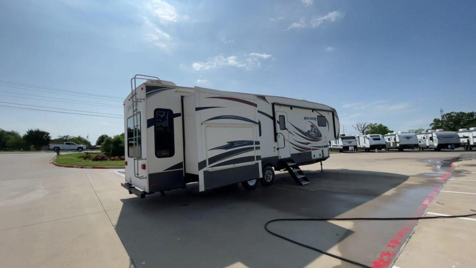 2014 KEYSTONE RV AVALANCHE 345TG (4YDF34521EE) , Length: 37.92 ft. | Dry Weight: 11,417 lbs. | Gross Weight: 14,140 lbs. | Slides: 3 transmission, located at 4319 N Main Street, Cleburne, TX, 76033, (817) 221-0660, 32.435829, -97.384178 - Set out on an adventure filled with luxury and comfort in the 2014 Keystone Avalanche 345TG, a fifth wheel crafted to elevate your RV experience. With its 37.92-foot size, this model seamlessly blends sophisticated design with functional features, making it an ideal sanctuary for your travels. Built - Photo#1