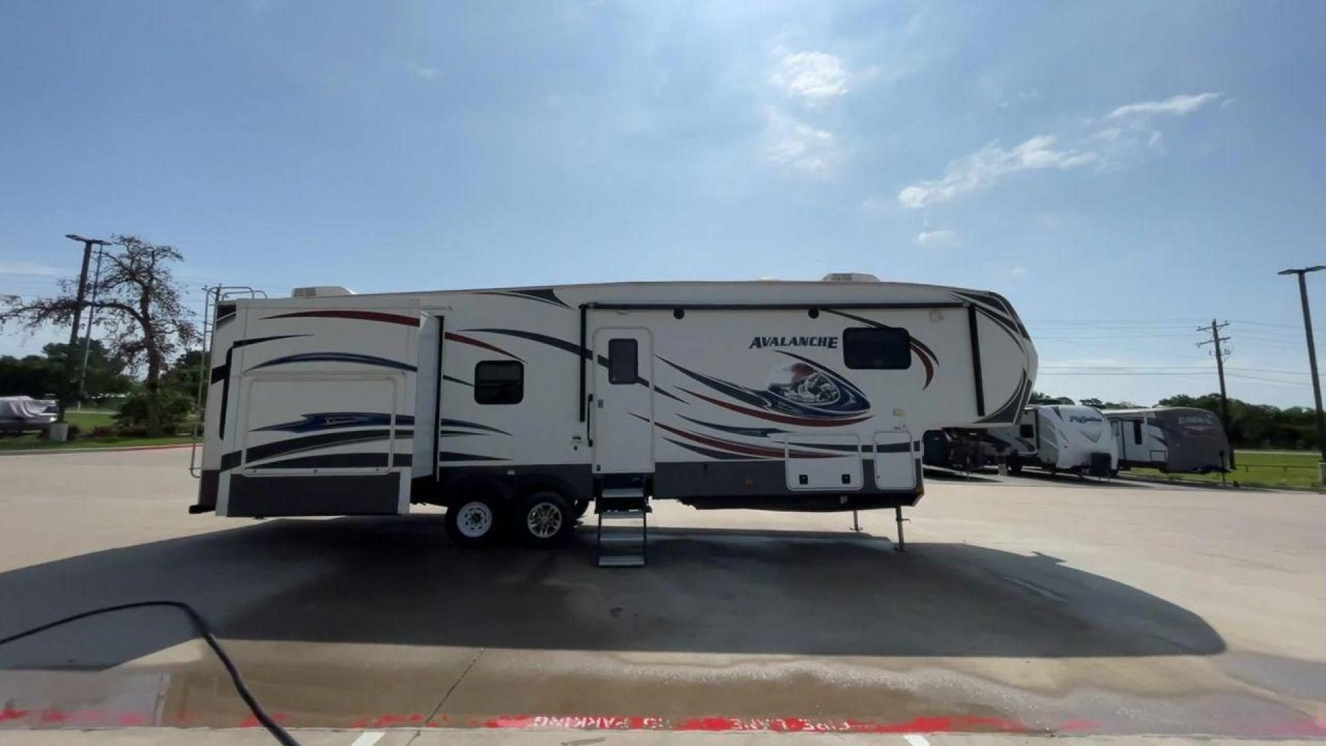 2014 KEYSTONE RV AVALANCHE 345TG (4YDF34521EE) , Length: 37.92 ft. | Dry Weight: 11,417 lbs. | Gross Weight: 14,140 lbs. | Slides: 3 transmission, located at 4319 N Main Street, Cleburne, TX, 76033, (817) 221-0660, 32.435829, -97.384178 - Set out on an adventure filled with luxury and comfort in the 2014 Keystone Avalanche 345TG, a fifth wheel crafted to elevate your RV experience. With its 37.92-foot size, this model seamlessly blends sophisticated design with functional features, making it an ideal sanctuary for your travels. Built - Photo#2