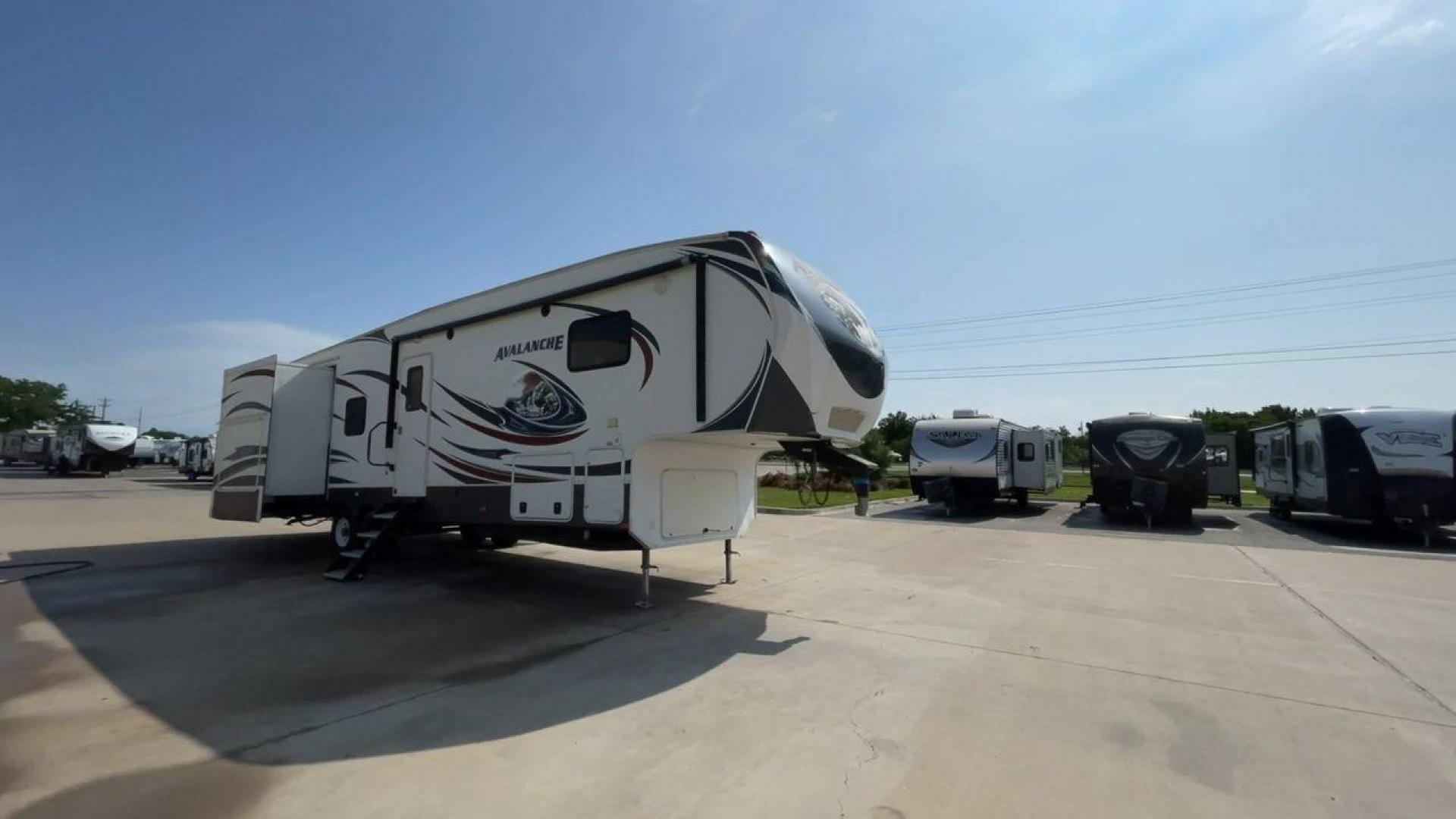 2014 KEYSTONE RV AVALANCHE 345TG (4YDF34521EE) , Length: 37.92 ft. | Dry Weight: 11,417 lbs. | Gross Weight: 14,140 lbs. | Slides: 3 transmission, located at 4319 N Main Street, Cleburne, TX, 76033, (817) 221-0660, 32.435829, -97.384178 - Set out on an adventure filled with luxury and comfort in the 2014 Keystone Avalanche 345TG, a fifth wheel crafted to elevate your RV experience. With its 37.92-foot size, this model seamlessly blends sophisticated design with functional features, making it an ideal sanctuary for your travels. Built - Photo#3