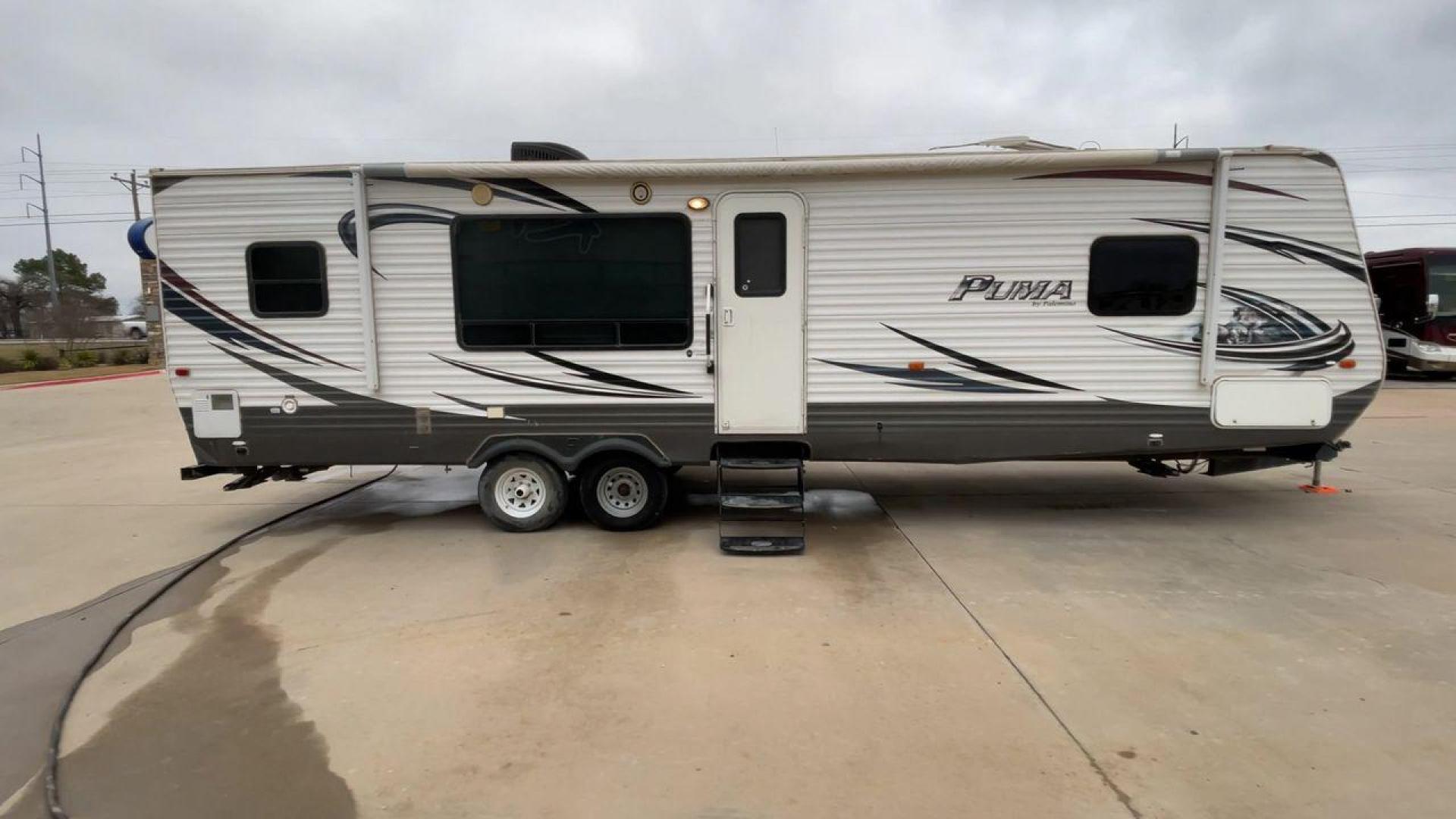 2014 WHITE PUMA 30RKSS (4X4TPUF23EP) , Length: 32.75 ft. | Dry Weight: 6,670 lbs. | Gross Weight: 9,827 lbs. | Slides: 1 transmission, located at 4319 N Main Street, Cleburne, TX, 76033, (817) 221-0660, 32.435829, -97.384178 - Looking for a travel trailer that offers comfort, convenience, and style? Look no further than this 2014 PUMA 30RKSS available at RV Depot in Cleburne, TX. With its spacious interior, sleek white exterior, and rear living layout, this travel trailer is perfect for your next adventure. The PUMA 30RK - Photo#2