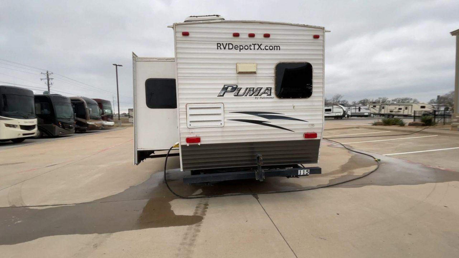 2014 WHITE PUMA 30RKSS (4X4TPUF23EP) , Length: 32.75 ft. | Dry Weight: 6,670 lbs. | Gross Weight: 9,827 lbs. | Slides: 1 transmission, located at 4319 N Main Street, Cleburne, TX, 76033, (817) 221-0660, 32.435829, -97.384178 - Looking for a travel trailer that offers comfort, convenience, and style? Look no further than this 2014 PUMA 30RKSS available at RV Depot in Cleburne, TX. With its spacious interior, sleek white exterior, and rear living layout, this travel trailer is perfect for your next adventure. The PUMA 30RK - Photo#8