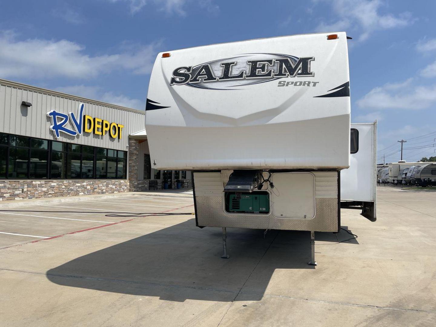 2014 GRAY SALEM 32SRVP - (4X4FSTH29ER) , Length: 34.5 ft. | Dry Weight: 8,198 lbs. | Slides: 1 transmission, located at 4319 N Main Street, Cleburne, TX, 76033, (817) 221-0660, 32.435829, -97.384178 - Take advantage of the 2014 Salem 32SRVP Toy Hauler and unleash your sense of adventure. With living space and a designated room for your favorite toys, this tough and adaptable RV is made to fit your outdoor lifestyle. The dimensions of this unit are 34.5 ft in length by 10.08 ft in height. It ha - Photo#0