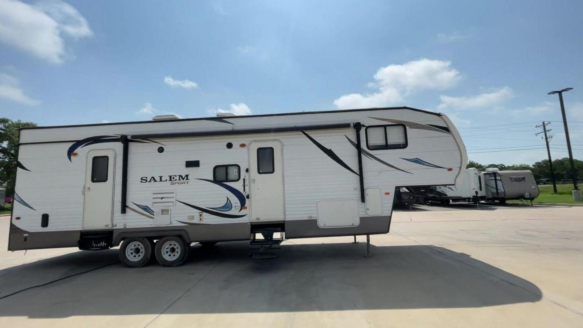 2014 GRAY SALEM 32SRVP - (4X4FSTH29ER) , Length: 34.5 ft. | Dry Weight: 8,198 lbs. | Slides: 1 transmission, located at 4319 N Main Street, Cleburne, TX, 76033, (817) 221-0660, 32.435829, -97.384178 - Take advantage of the 2014 Salem 32SRVP Toy Hauler and unleash your sense of adventure. With living space and a designated room for your favorite toys, this tough and adaptable RV is made to fit your outdoor lifestyle. The dimensions of this unit are 34.5 ft in length by 10.08 ft in height. It ha - Photo#2