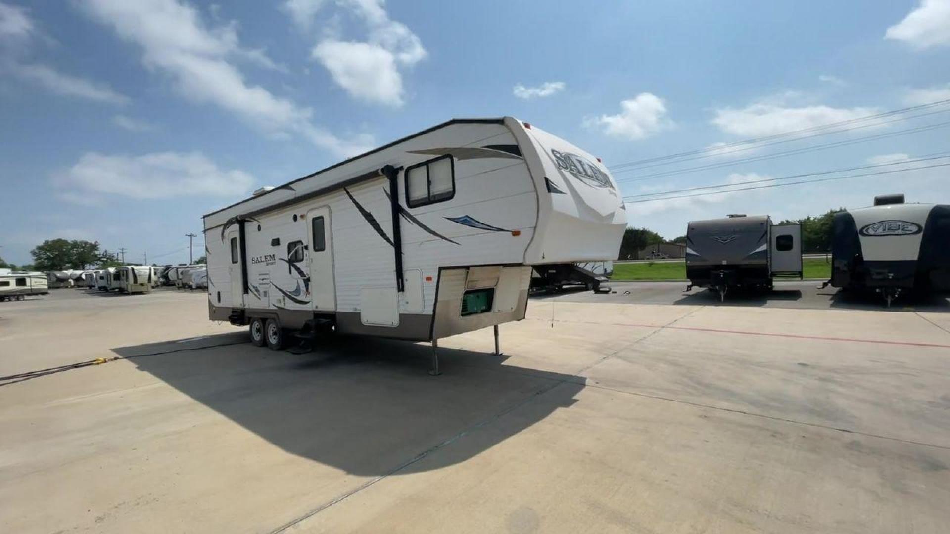 2014 GRAY SALEM 32SRVP - (4X4FSTH29ER) , Length: 34.5 ft. | Dry Weight: 8,198 lbs. | Slides: 1 transmission, located at 4319 N Main Street, Cleburne, TX, 76033, (817) 221-0660, 32.435829, -97.384178 - Take advantage of the 2014 Salem 32SRVP Toy Hauler and unleash your sense of adventure. With living space and a designated room for your favorite toys, this tough and adaptable RV is made to fit your outdoor lifestyle. The dimensions of this unit are 34.5 ft in length by 10.08 ft in height. It ha - Photo#3