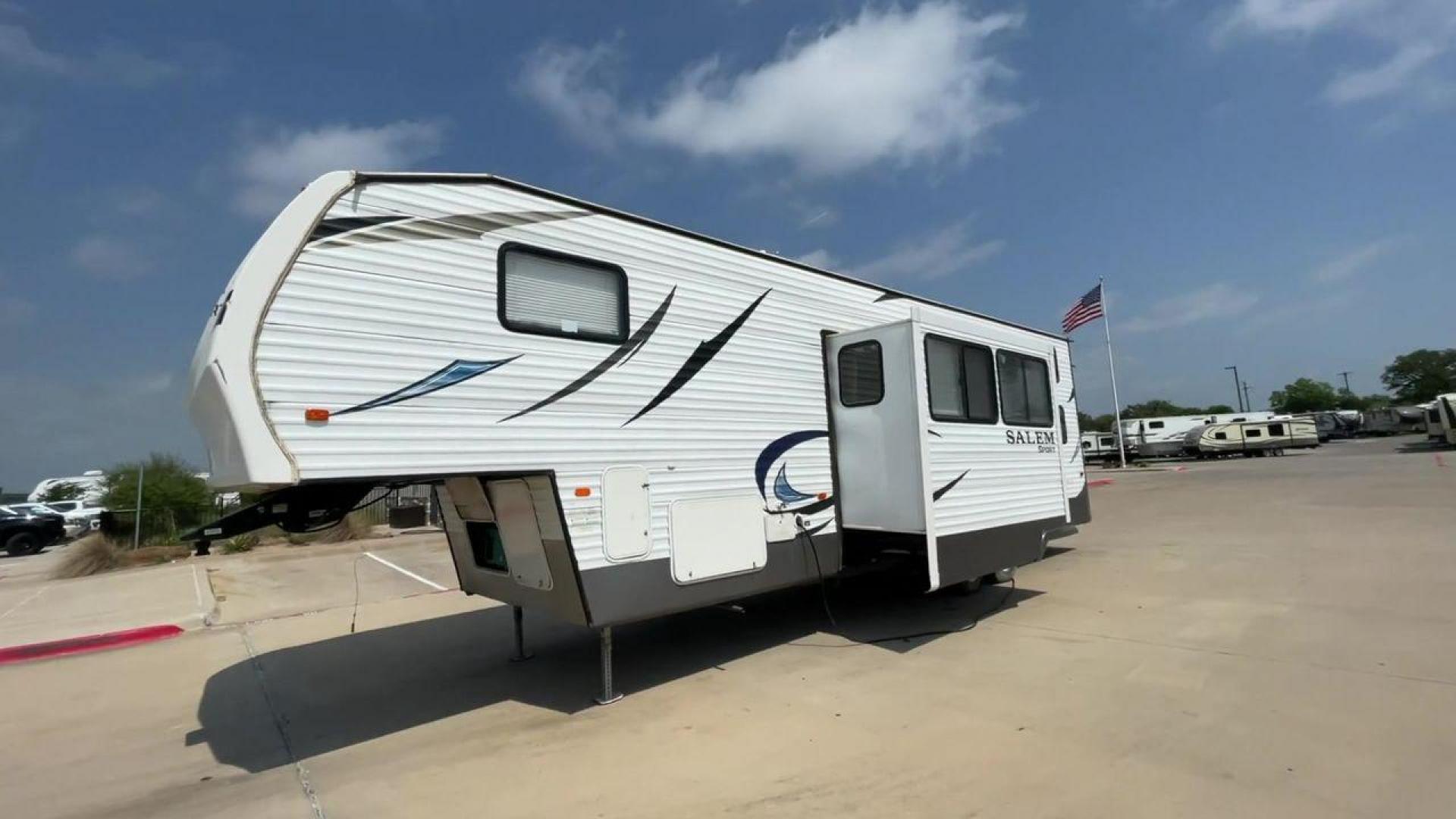 2014 GRAY SALEM 32SRVP - (4X4FSTH29ER) , Length: 34.5 ft. | Dry Weight: 8,198 lbs. | Slides: 1 transmission, located at 4319 N Main Street, Cleburne, TX, 76033, (817) 221-0660, 32.435829, -97.384178 - Take advantage of the 2014 Salem 32SRVP Toy Hauler and unleash your sense of adventure. With living space and a designated room for your favorite toys, this tough and adaptable RV is made to fit your outdoor lifestyle. The dimensions of this unit are 34.5 ft in length by 10.08 ft in height. It ha - Photo#5