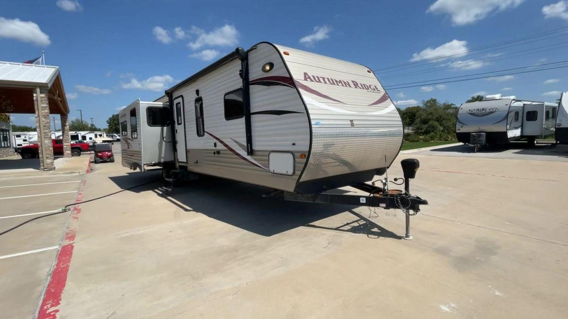 2014 WHITE STARCRAFT AUTUMN RIDGE346 RESA (1SABS0BU0E2) , Length: 38.25 ft. | Dry Weight: 8,385 lbs. | Gross Weight: 10,750 lbs. | Slides: 3 transmission, located at 4319 N Main Street, Cleburne, TX, 76033, (817) 221-0660, 32.435829, -97.384178 - With the 2014 Starcraft Autumn Ridge 346RESA travel trailer, you can unleash your inner explorer. For your outdoor adventures, this finely built and feature-rich RV is intended to bring you a cozy and delightful home away from home. This trailer has dimensions of 38.25 ft in length, 8 ft in width, a - Photo#3