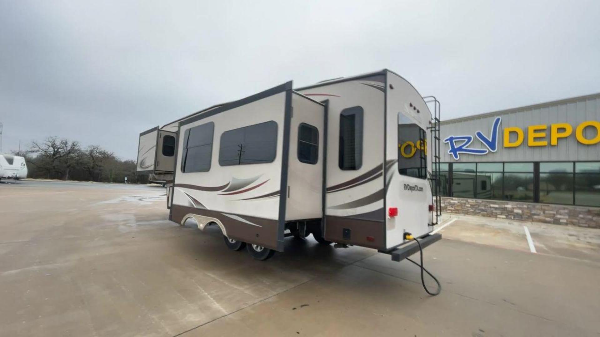 2014 TAN SUNDANCE 2880RLT (5SFSG3320EE) , Length: 32.2 ft. | Dry Weight: 9,750 lbs. | Gross Weight: 13,800 lbs. | Slides: 3 transmission, located at 4319 N Main Street, Cleburne, TX, 76033, (817) 221-0660, 32.435829, -97.384178 - This 2014 Sundance Fifth Wheel is just over 32 feet long and 8 feet wide. It has a GVWR of 13,800 lbs and a hitch weight of 2,220 lbs. The exterior of this fifth wheel is a stylish grey with brown, white, and beige decals. This model also has three slides and a 16-foot power-retractable awning. The - Photo#7