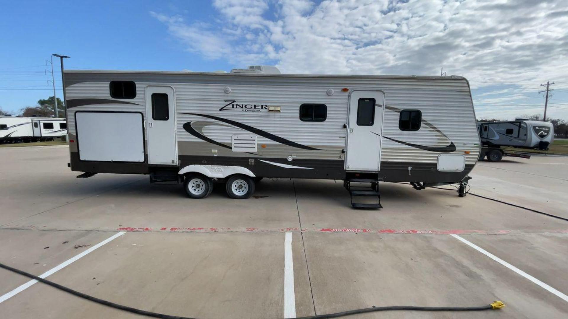 2014 TAN ZINGER 31SB (4V0TC3126EJ) , Length: 35.5 ft.| Dry Weight: 7,875 lbs. | Gross Weight: 9,671 lbs. | Slides: 2 transmission, located at 4319 N Main Street, Cleburne, TX, 76033, (817) 221-0660, 32.435829, -97.384178 - This 2014 CrossRoads Zinger 31SB travel trailer measures 35.5 feet. It is a dual axle, steel wheel setup with electric drum brakes. Its dry weight is 7,875 lbs. Its payload is 1,796 lbs, hitch weight is 1,071 lbs and the GVWR 9.671 lbs. The fiberglass exterior is painted white and tan with dark tan - Photo#2