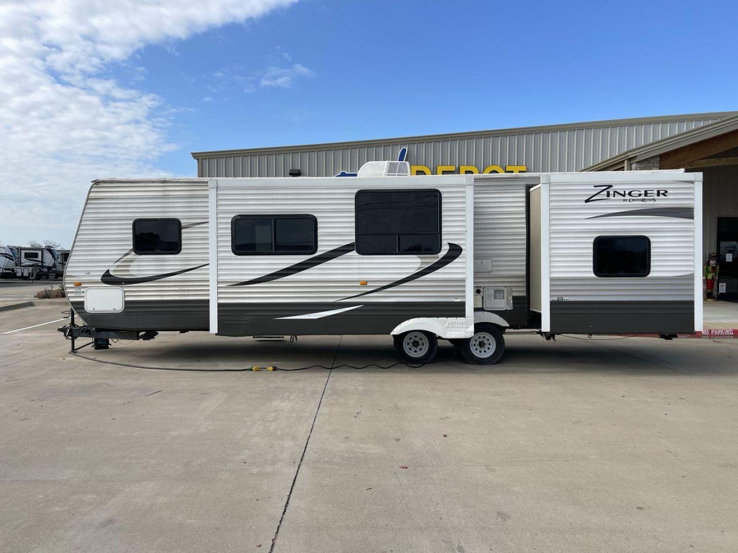 2014 TAN ZINGER 31SB (4V0TC3126EJ) , Length: 35.5 ft.| Dry Weight: 7,875 lbs. | Gross Weight: 9,671 lbs. | Slides: 2 transmission, located at 4319 N Main Street, Cleburne, TX, 76033, (817) 221-0660, 32.435829, -97.384178 - This 2014 CrossRoads Zinger 31SB travel trailer measures 35.5 feet. It is a dual axle, steel wheel setup with electric drum brakes. Its dry weight is 7,875 lbs. Its payload is 1,796 lbs, hitch weight is 1,071 lbs and the GVWR 9.671 lbs. The fiberglass exterior is painted white and tan with dark tan - Photo#23